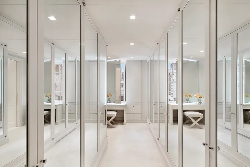 a bathroom with a glass shower door and a sink