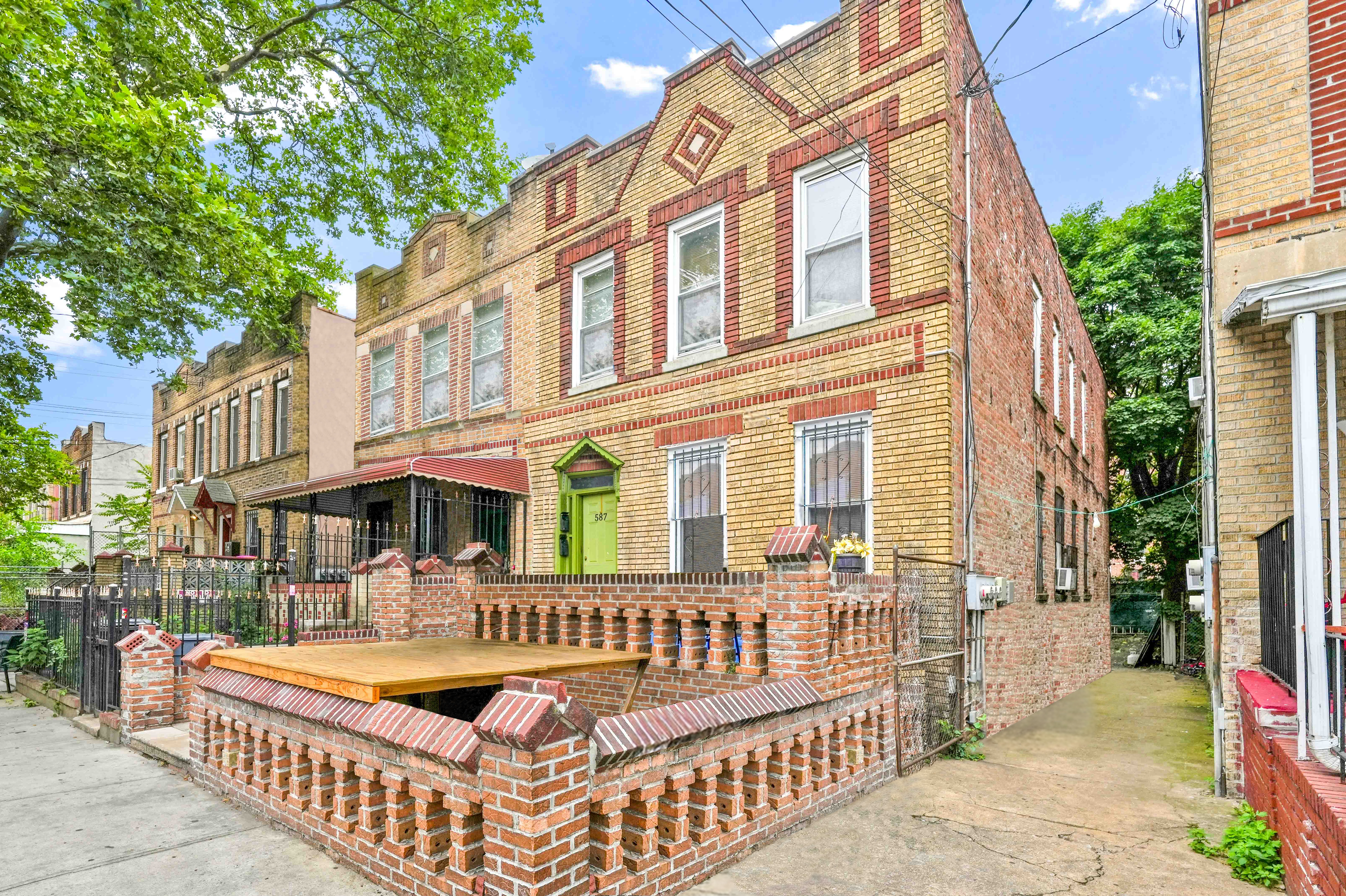 587 Osborn Street Brooklyn, NY 11212 - Photo 4 of 10 front view of a house with a porch