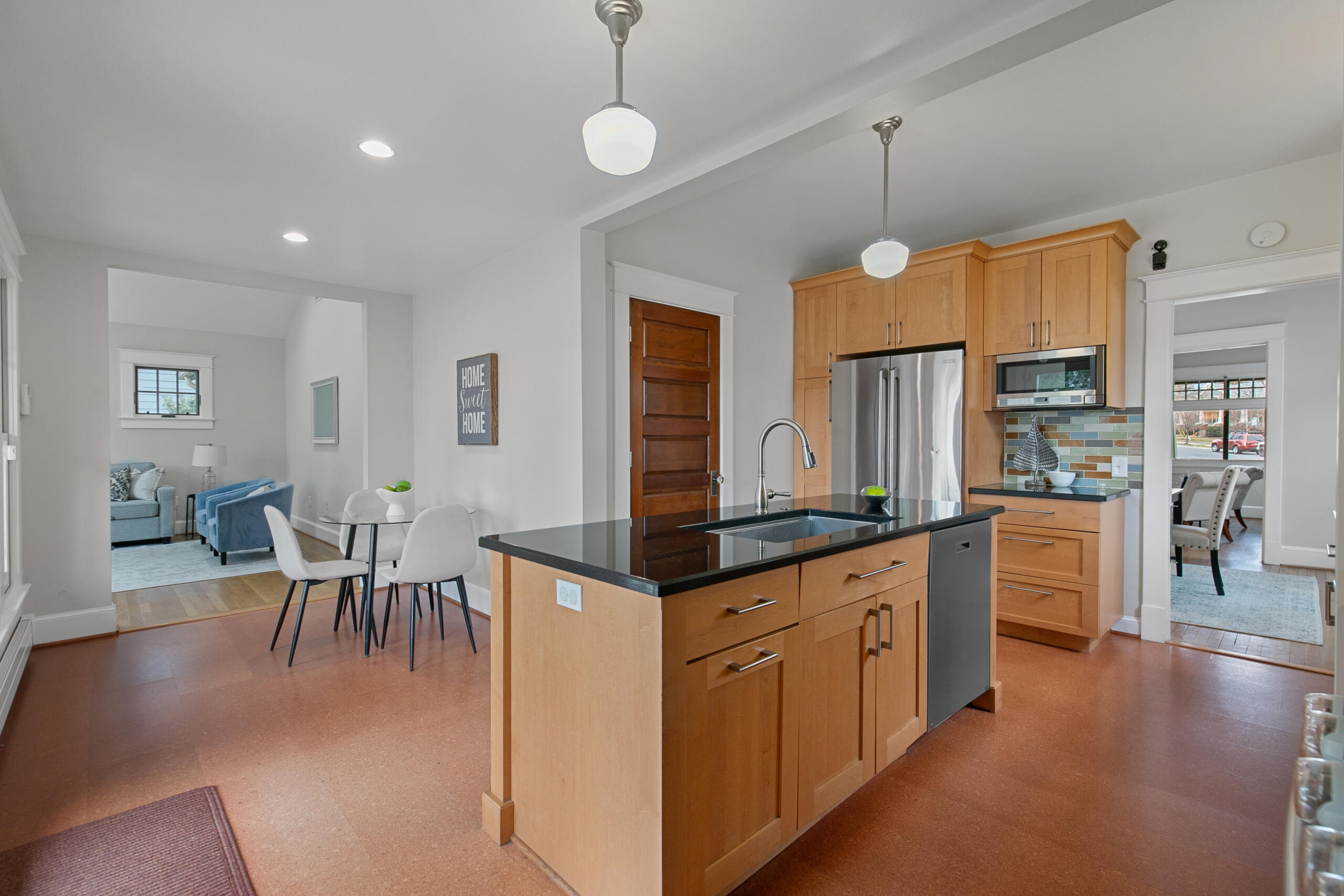 1908 Glen Ross Road Silver Spring, MD 20910 - Photo 22 of 63 a kitchen with granite countertop a center island a sink stainless steel appliances and cabinets