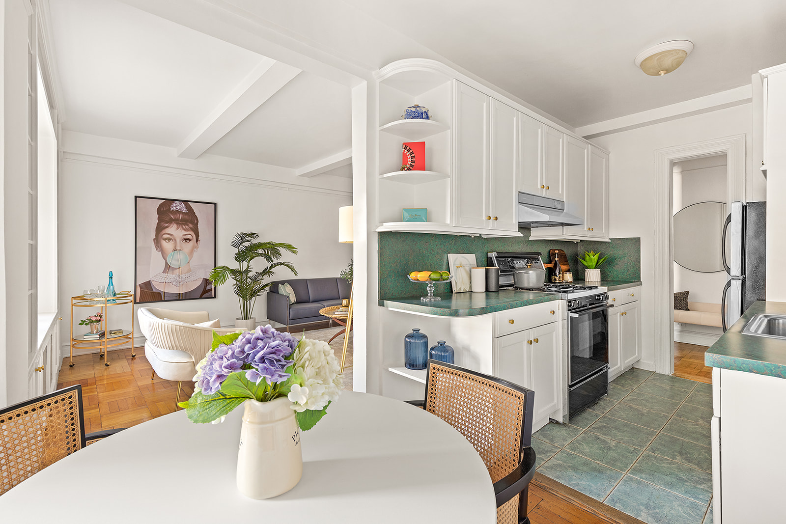 175 West 93rd Street, Unit 12K Manhattan, NY 10025 - Photo 3 of 10 a kitchen that has a lot of white cabinets and stainless steel appliances