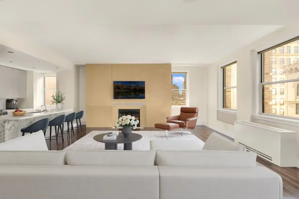 a living room with fireplace furniture and a flat screen tv