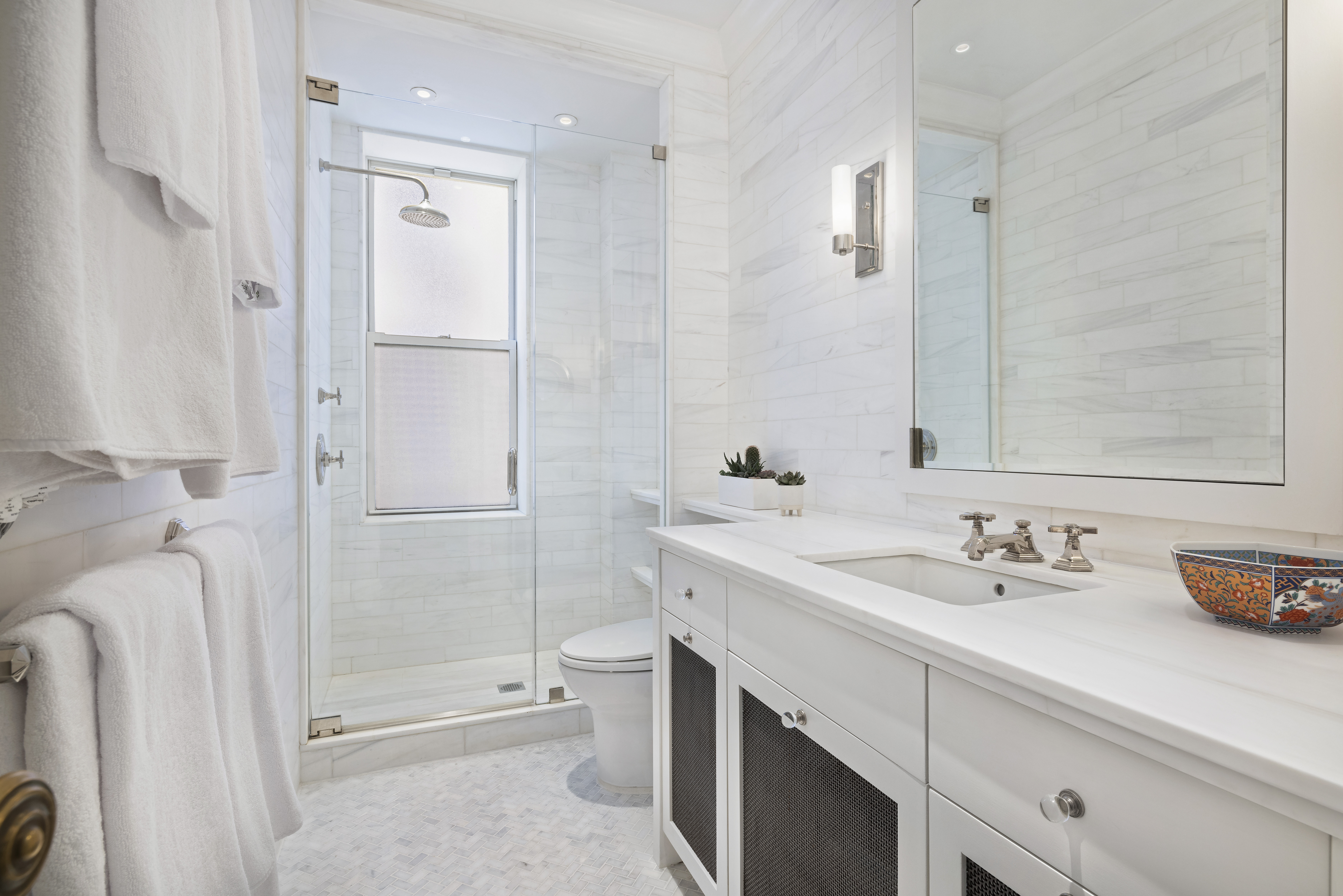 325 West End Avenue, Unit 6AB Manhattan, NY 10023 - Photo 11 of 22 a bathroom with a sink a toilet and shower