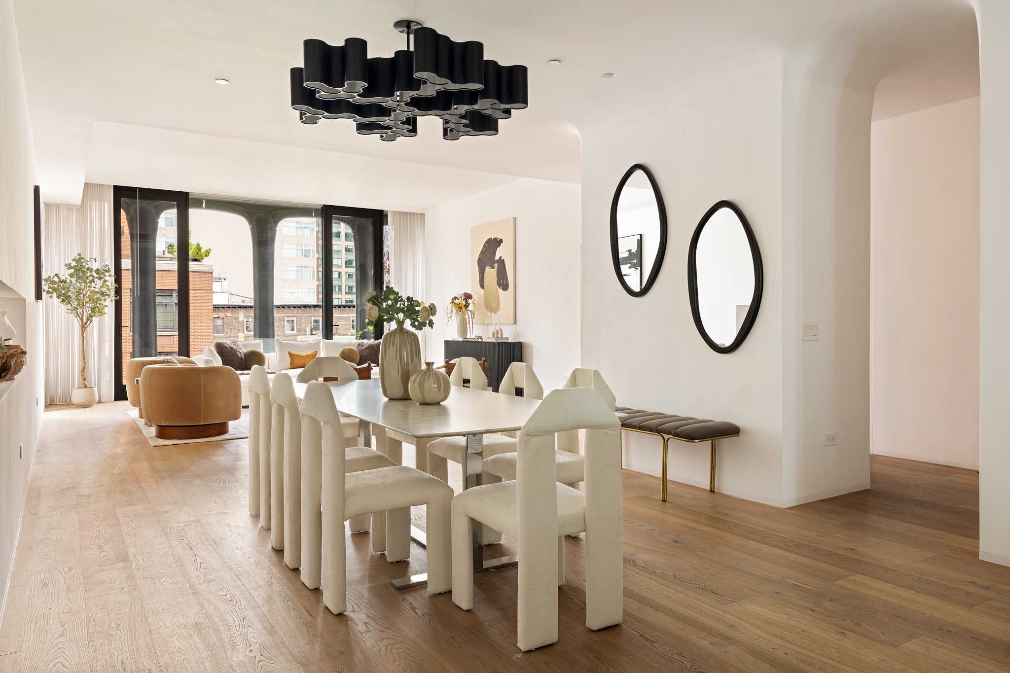 325 West Broadway, Unit 7B Manhattan, NY 10013 - Photo 4 of 21 a view of a dining room with furniture a chandelier and wooden floor