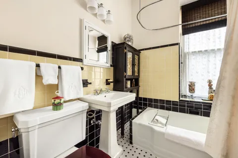 a bathroom with a sink a bathtub and a shower