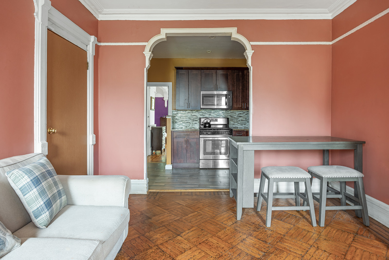 621 Putnam Avenue Brooklyn, NY 11221 - Photo 11 of 17 a living room with furniture and a rug
