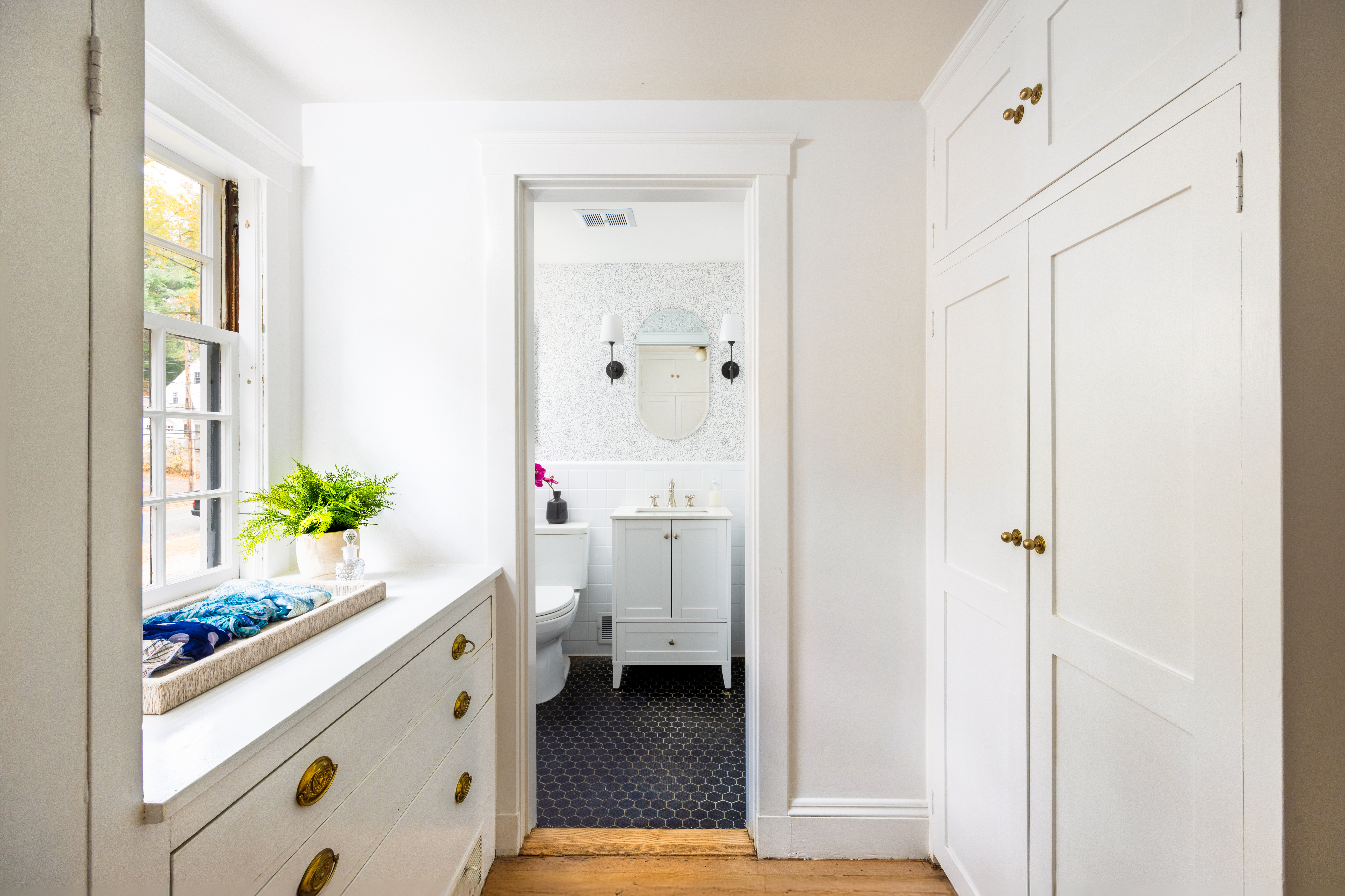 111 Beverly Road Brookline, MA 02467 - Photo 17 of 27 a bathroom with a granite countertop sink a vanity and a window