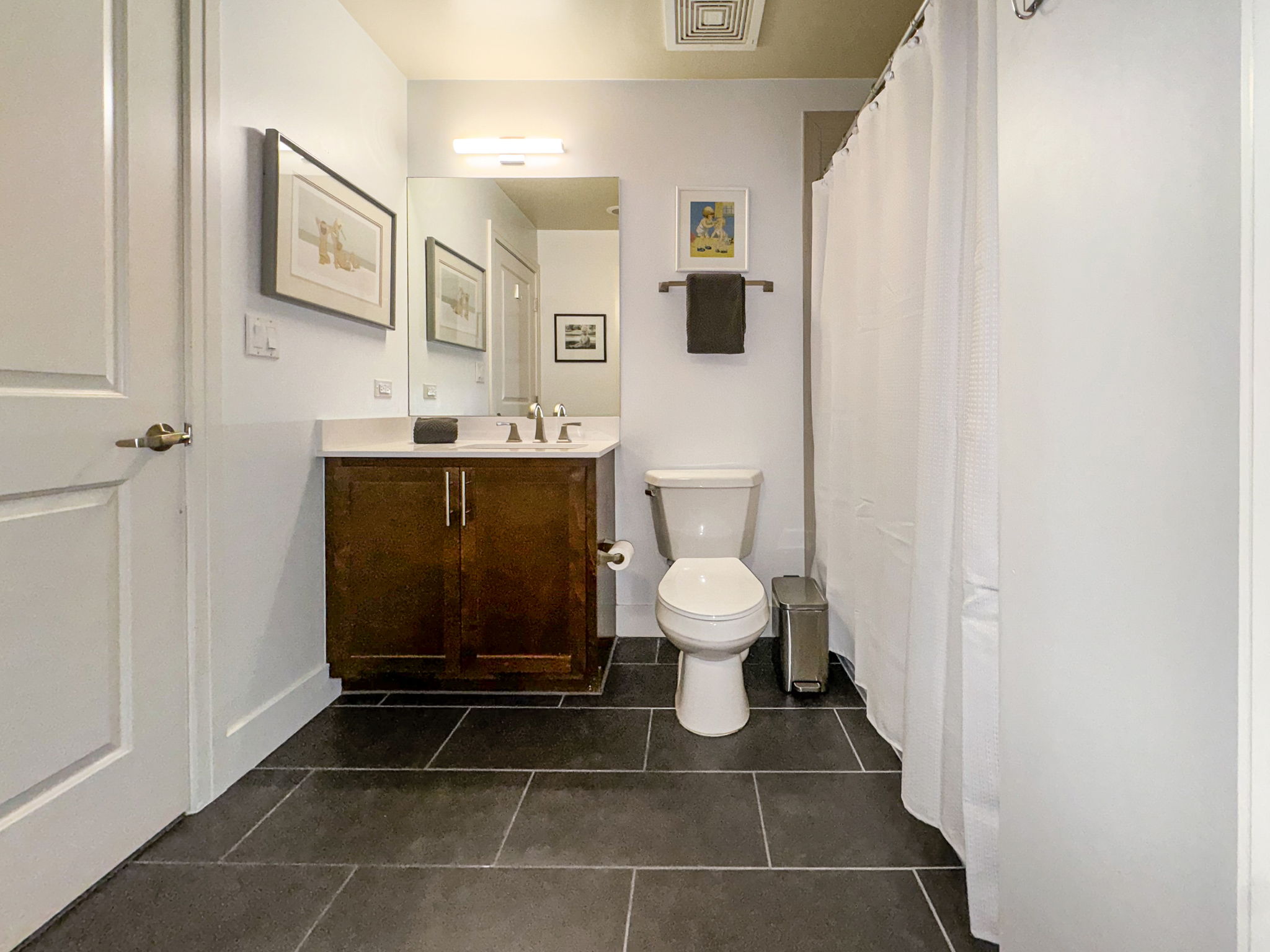3401 Arapahoe Avenue, Unit Undisclosed Boulder, CO 80303 - Photo 7 of 28 a bathroom with a toilet a sink and mirror