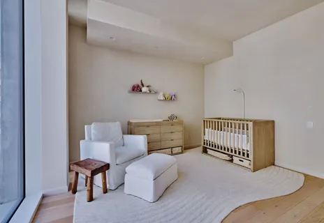 a bedroom with furniture and a wooden floor
