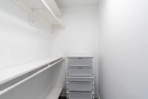 a view of an empty walk in closet