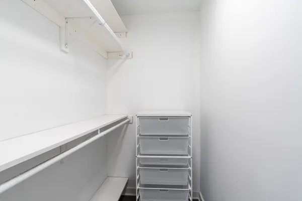 a view of an empty walk in closet