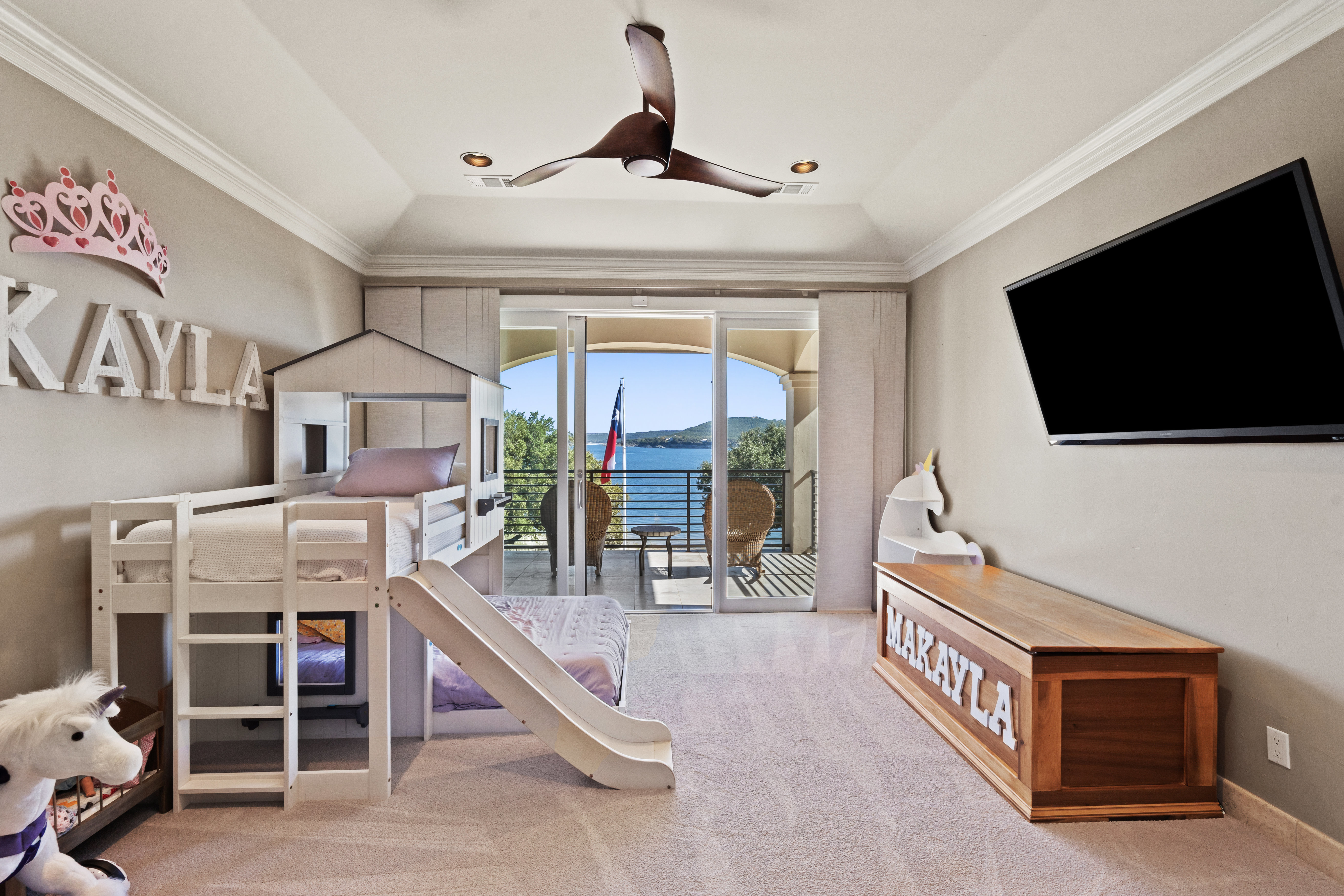 15210 Rainbow 1 Street Austin, TX 78734 - Photo 41 of 138 a living room with furniture a flat screen tv and a large window