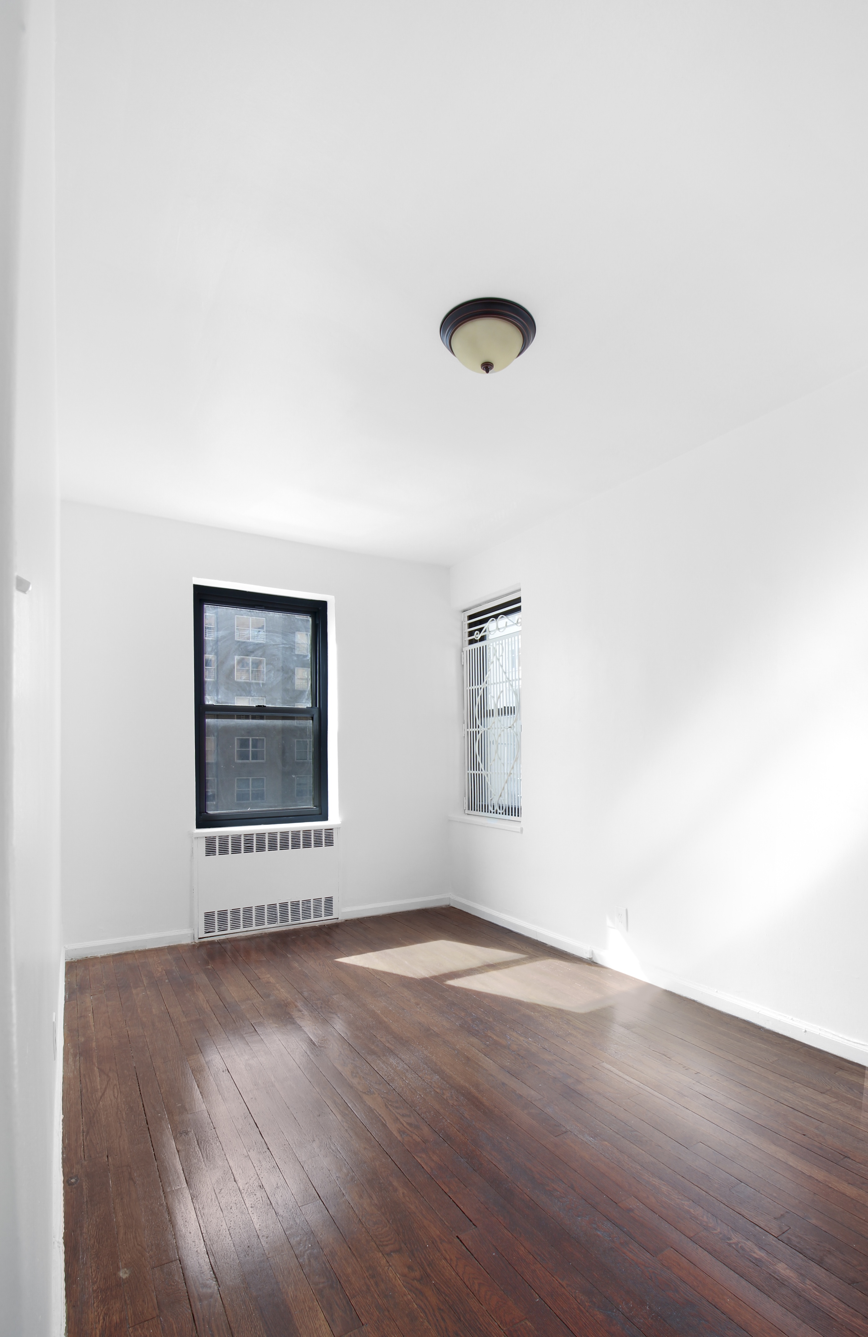 315 East 56th Street, Unit 5H Manhattan, NY 10022 - Photo 7 of 9 a view of a room with wooden floor