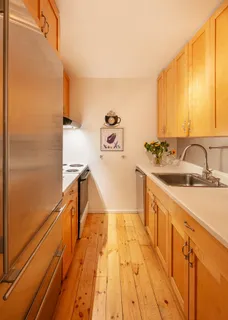 a spacious bathroom with a sink and mirror