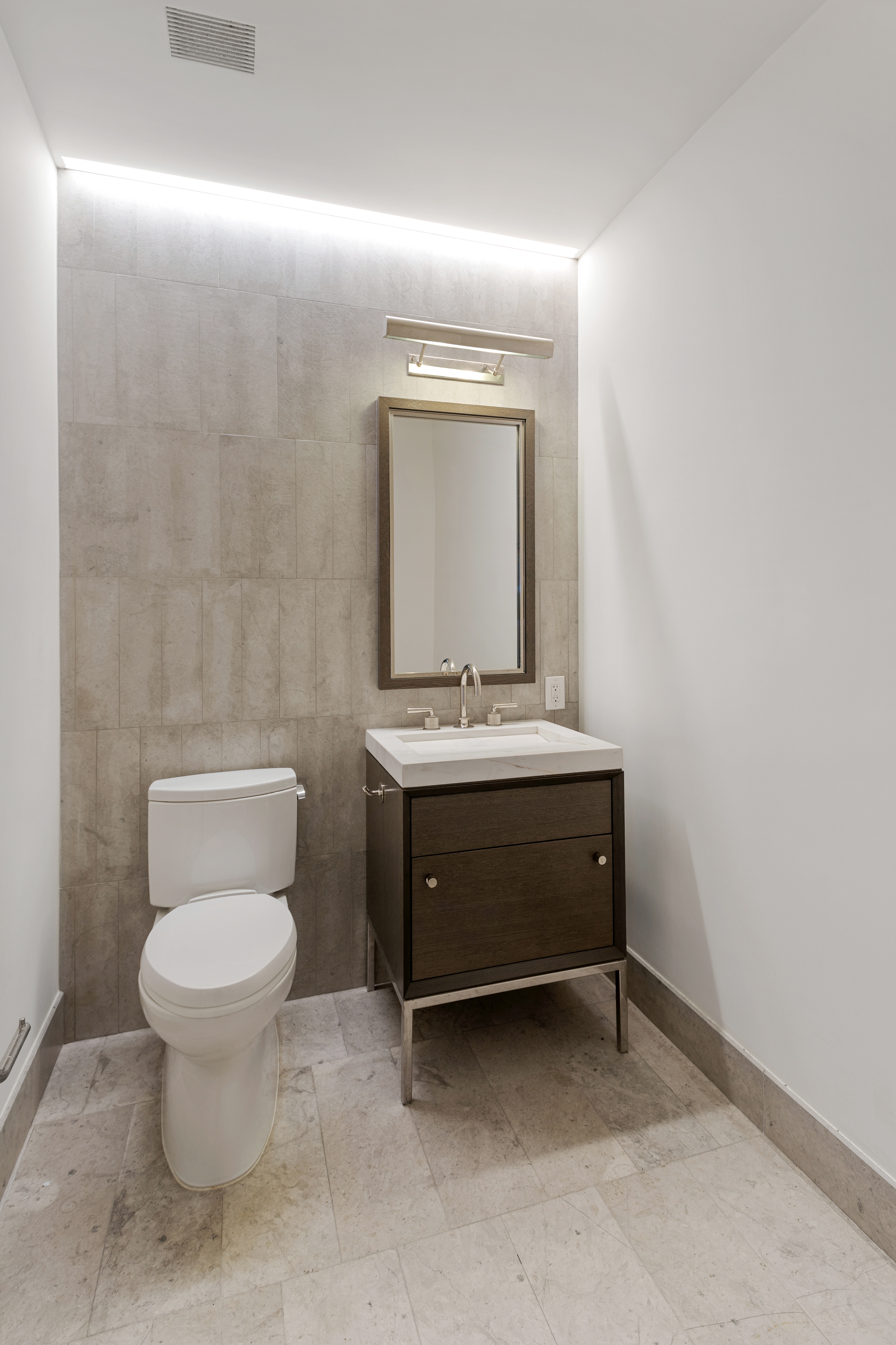 301 East 50th Street, Unit 17B Manhattan, NY 10022 - Photo 5 of 12 a bathroom with a sink and a toilet