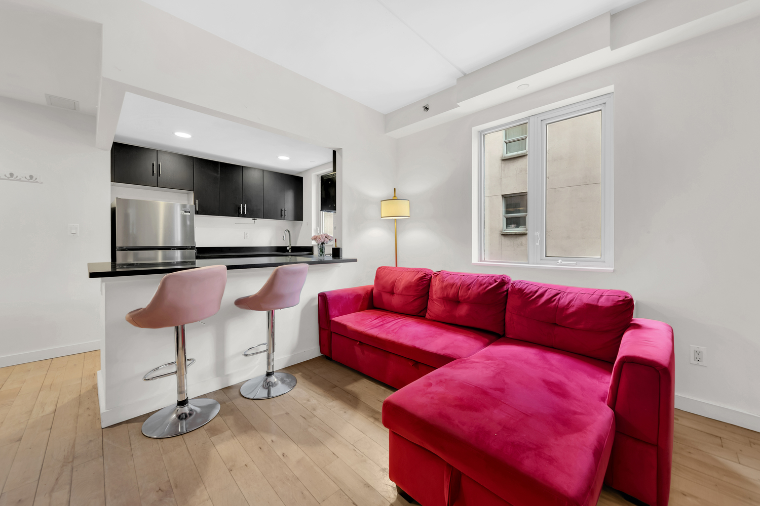 1810 3rd Avenue, Unit A7C Manhattan, NY 10029 - Photo 2 of 12 a living room with furniture and a flat screen tv