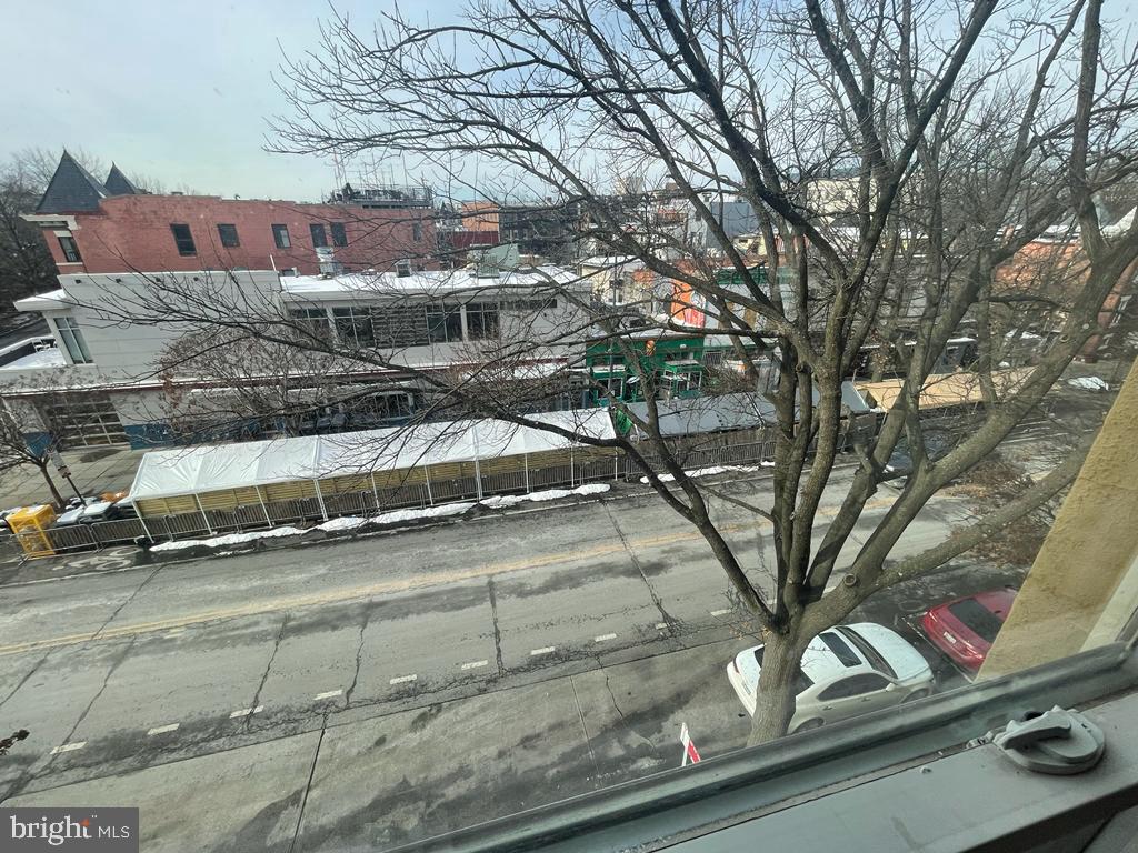 1033 Park Road Northwest, Unit 6 Washington, DC 20010 - Photo 17 of 38 a front view of a house with a yard