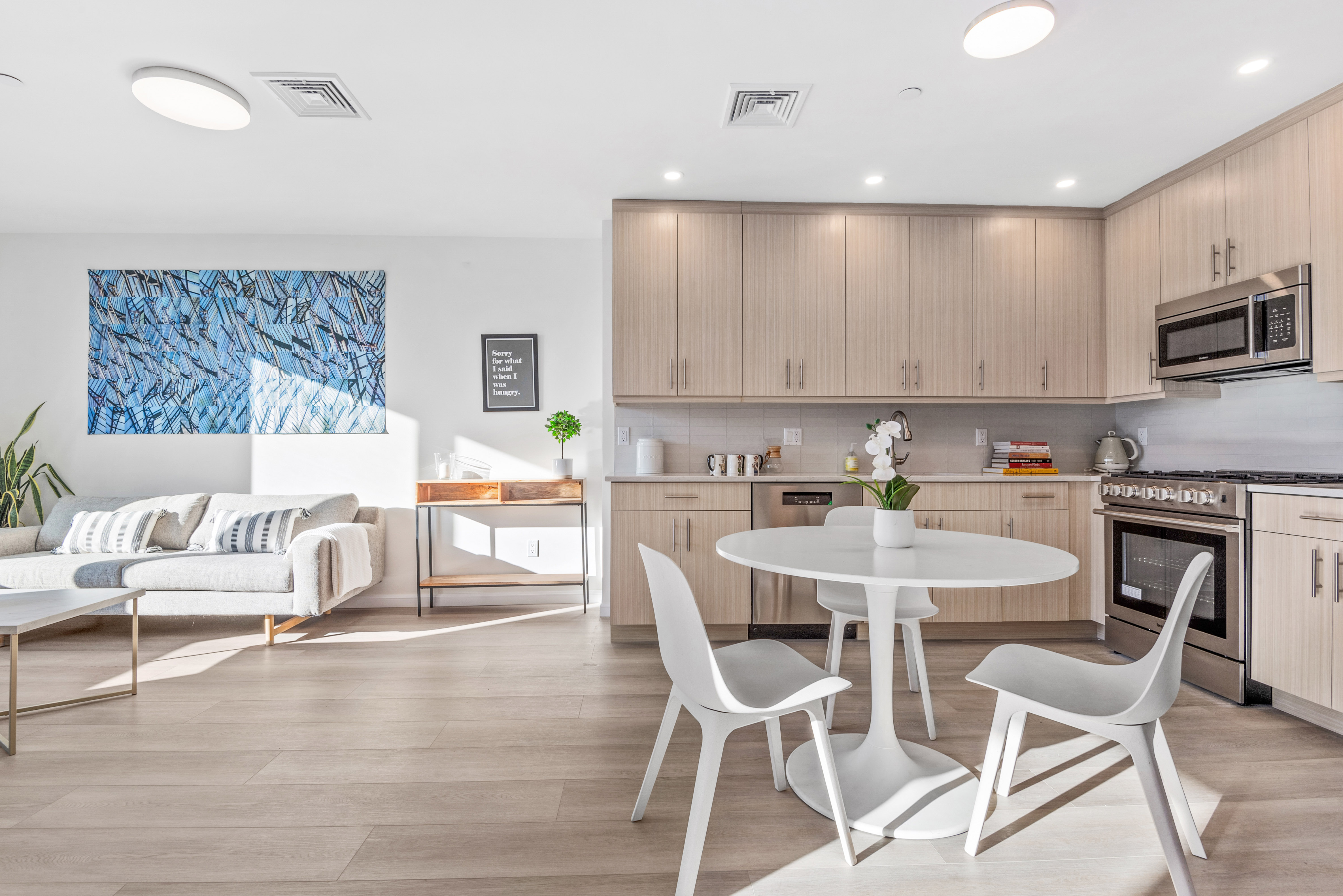1 Lenox Road, Unit 5E Brooklyn, NY 11226 - Photo 3 of 13 a kitchen with kitchen island a dining table and chairs