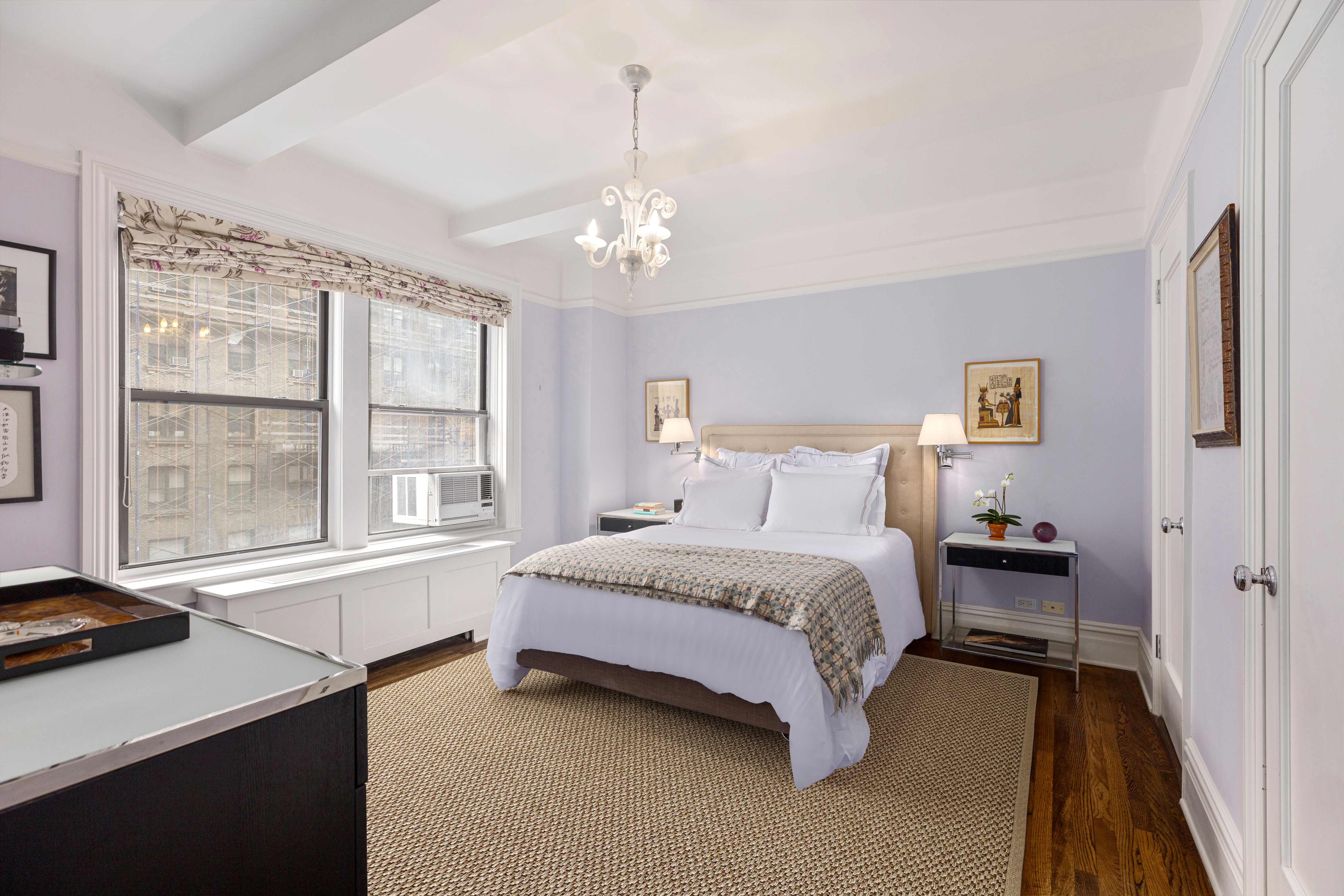 515 West End Avenue, Unit 8B Manhattan, NY 10024 - Photo 7 of 12 a spacious bedroom with a bed and a window