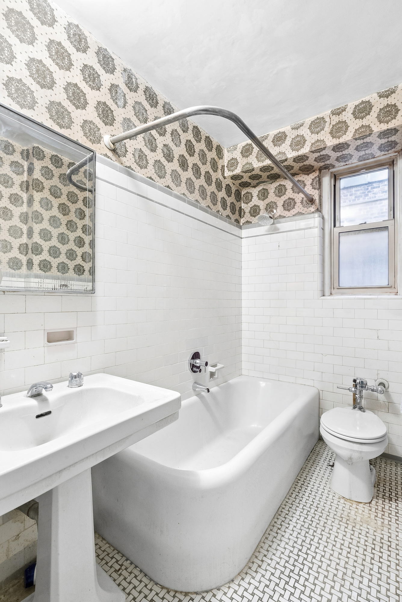 12 West 96th Street, Unit 9A Manhattan, NY 10025 - Photo 13 of 14 a bathroom with a sink and a mirror