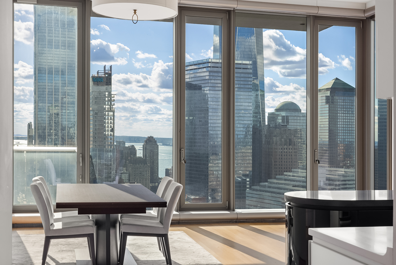56 Leonard Street, Unit 39BEAST Manhattan, NY 10013 - Photo 2 of 18 a view of a room with a large window and dining table