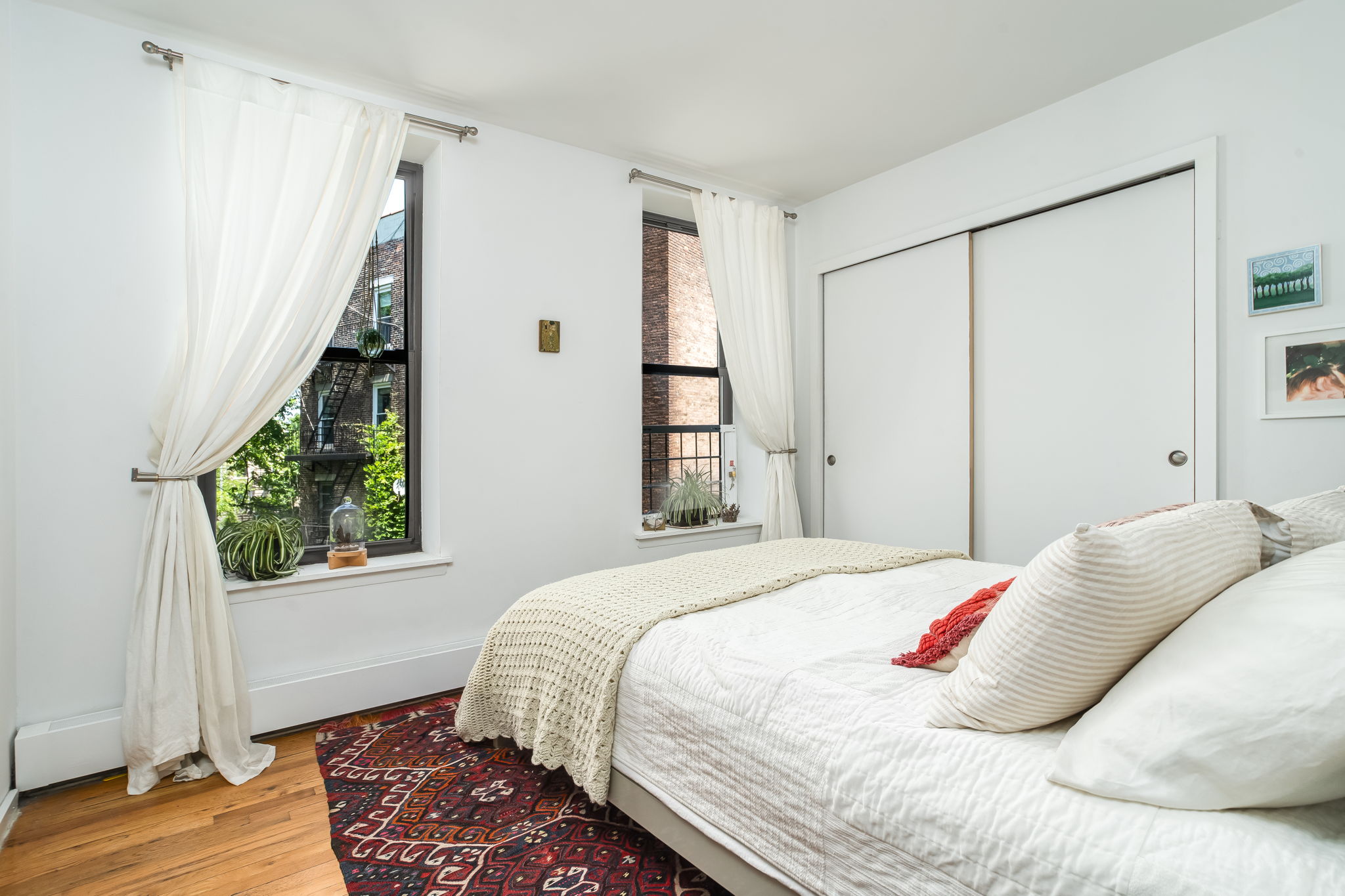 427 St Johns Place, Unit 2B Brooklyn, NY 11238 - Photo 6 of 11 a bedroom with a bed and a window