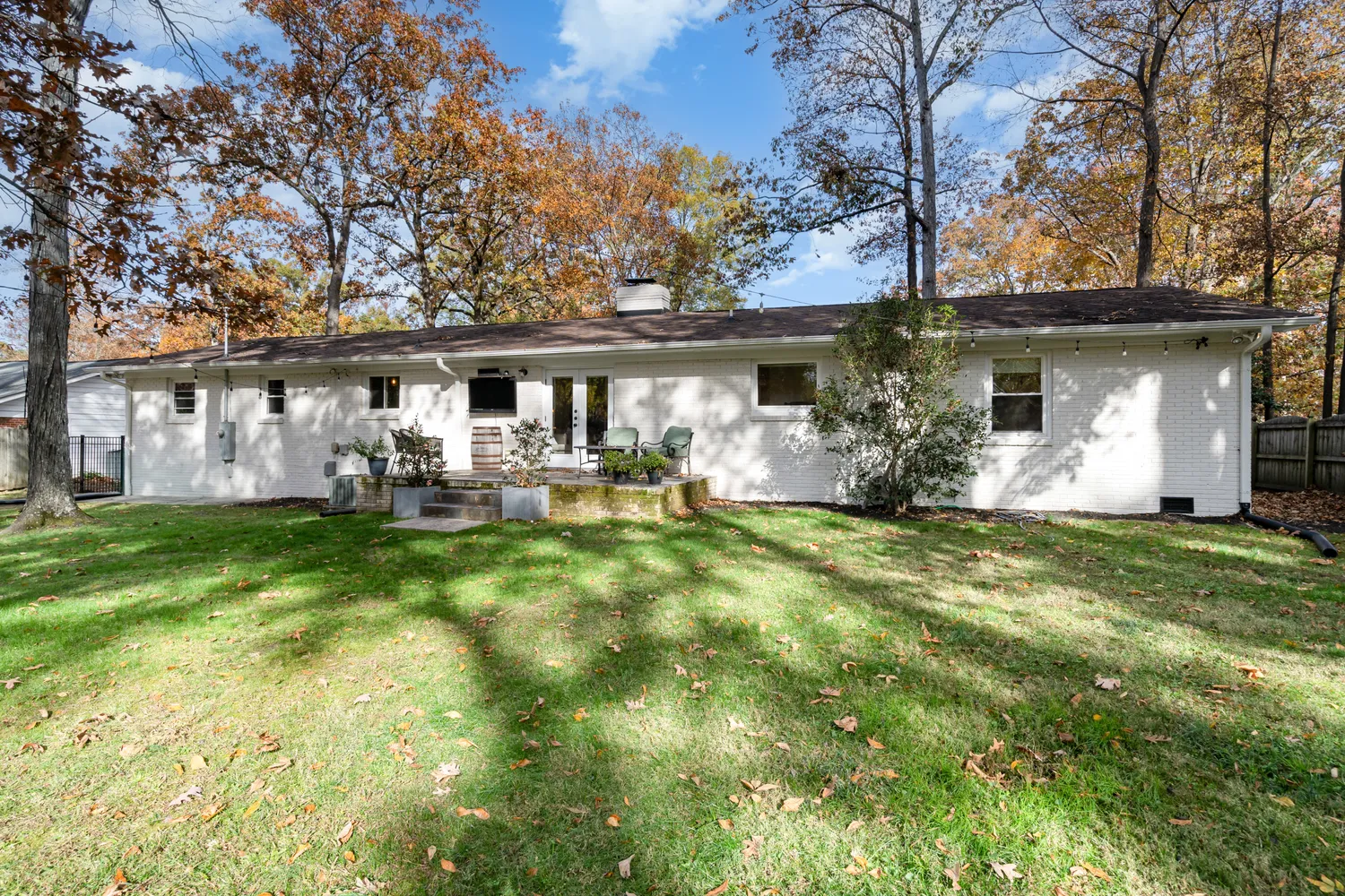 a front view of house with yard and green space
