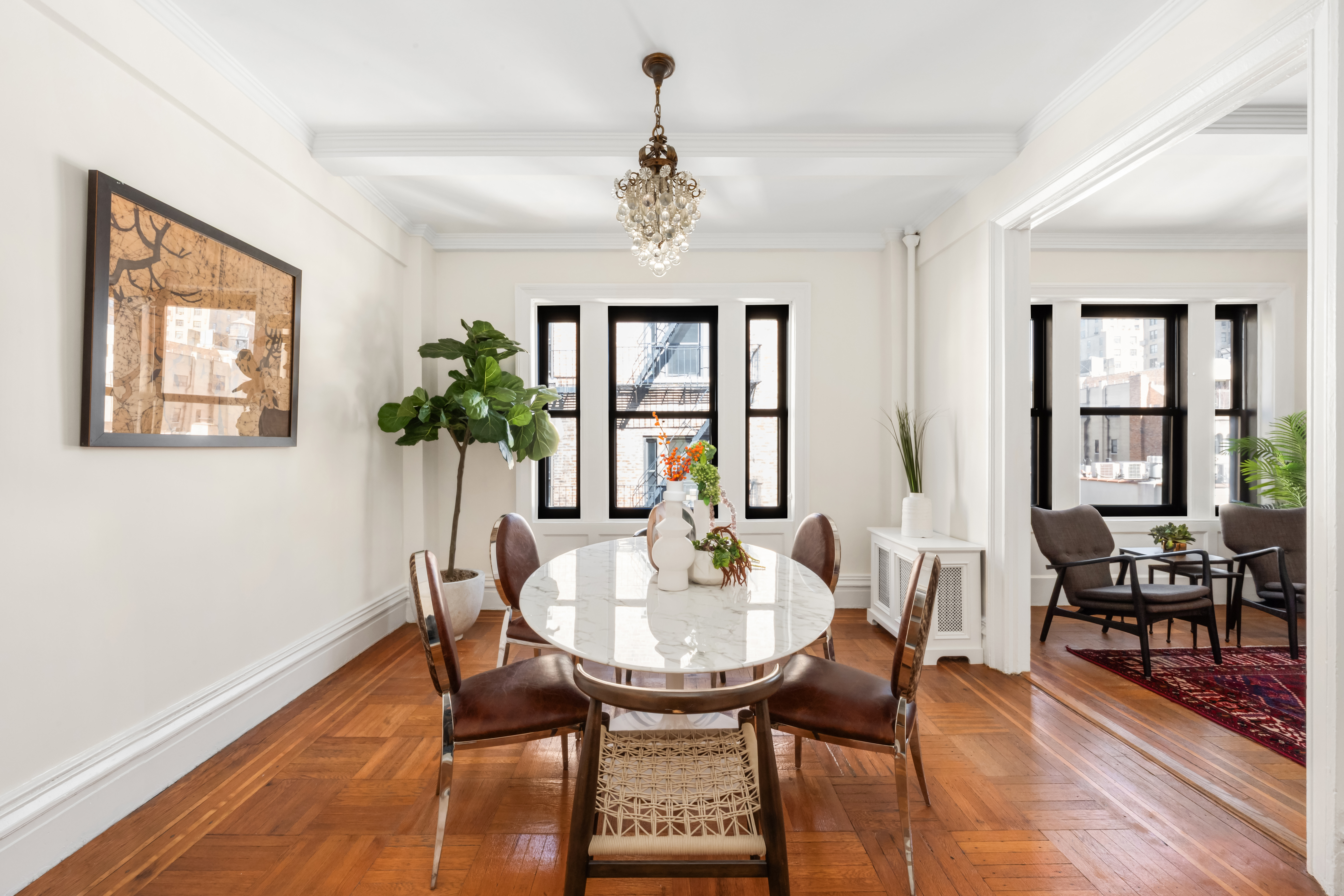 35 West 82nd Street, Unit 8C Manhattan, NY 10024 - Photo 3 of 10 a view of a dining room with furniture window and wooden floor