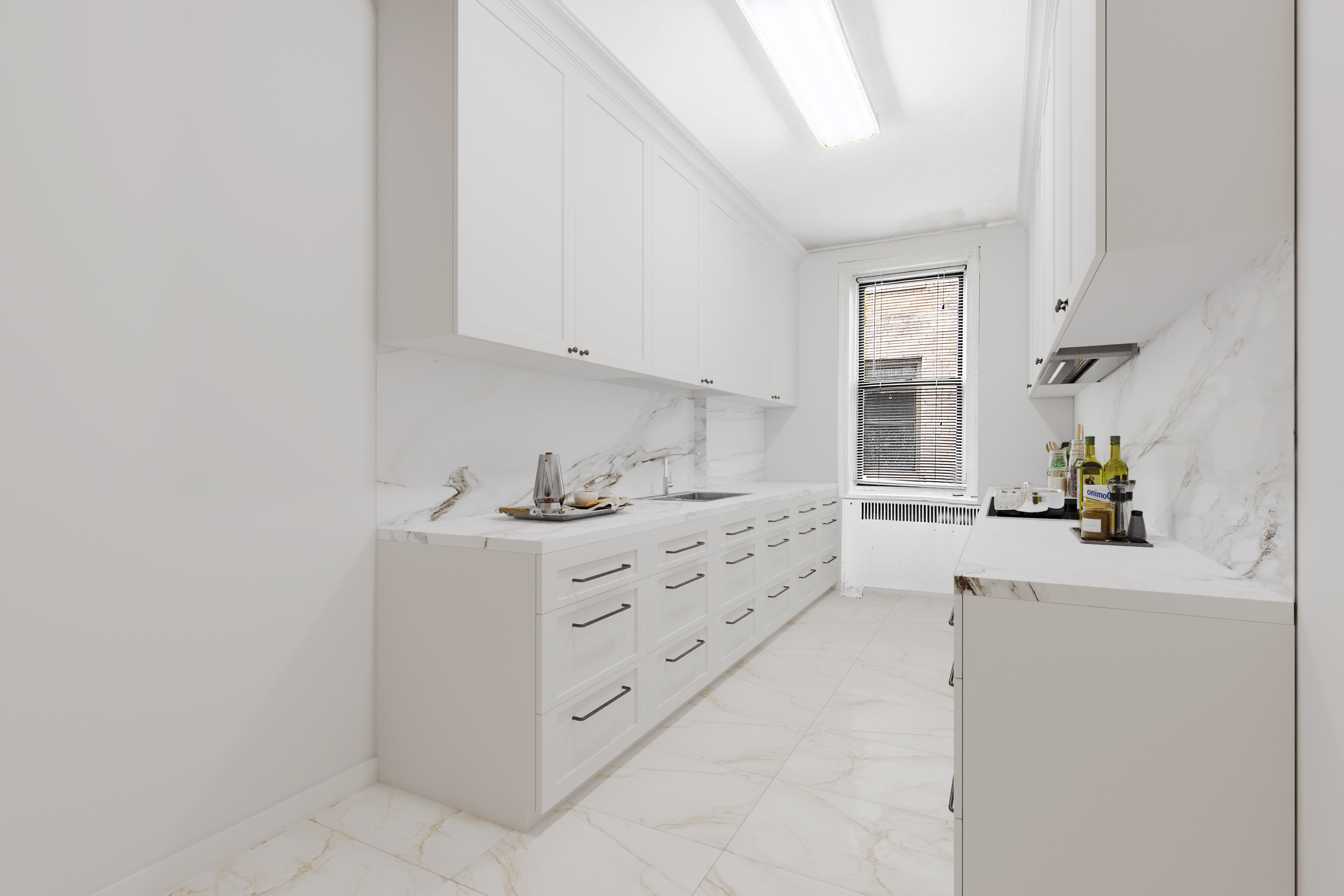 43-08 41st Street, Unit 5D Queens, NY 11104 - Photo 4 of 6 a kitchen with cabinets appliances and a window