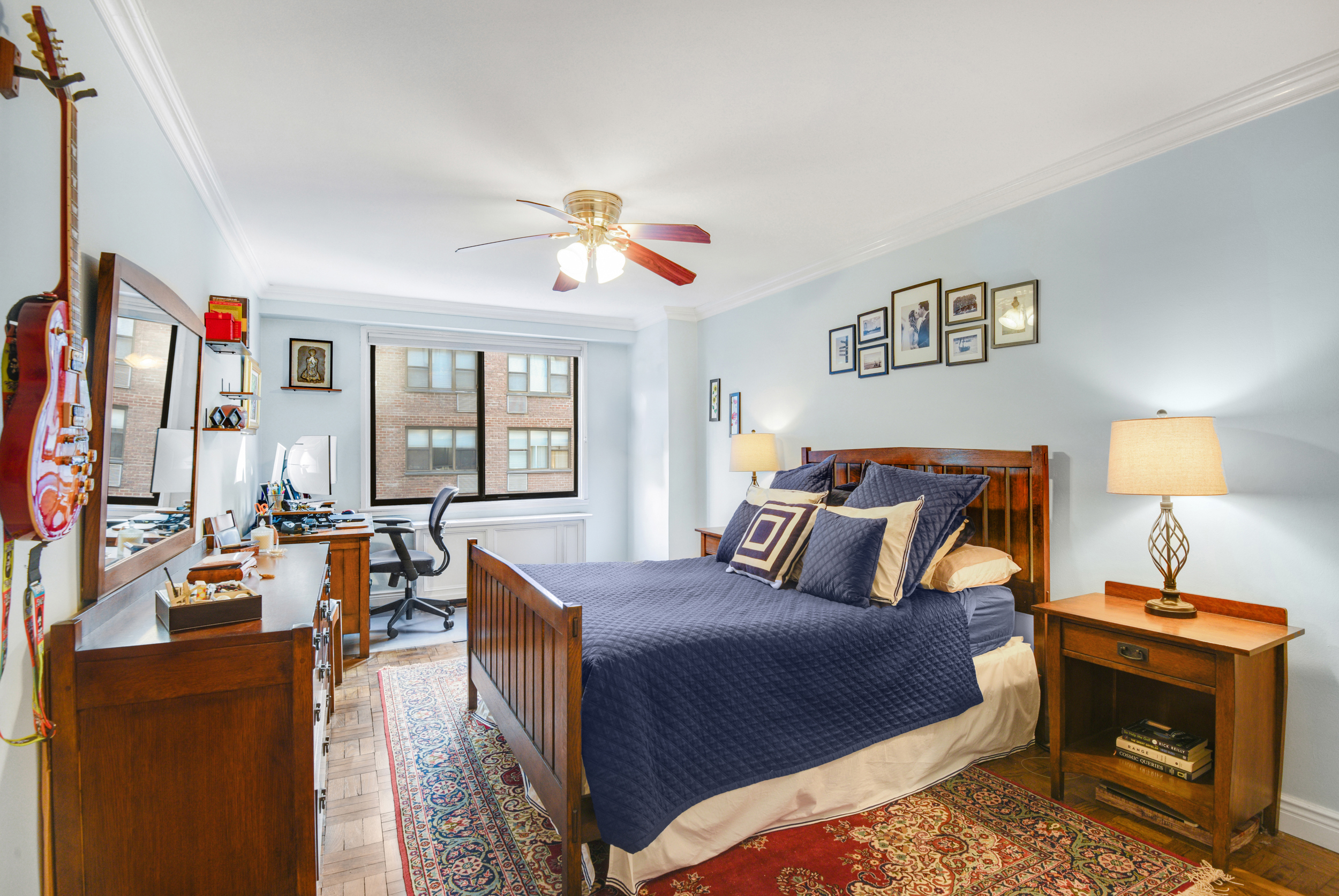 345 East 73rd Street, Unit 7J Manhattan, NY 10021 - Photo 8 of 13 a bedroom with furniture and a window