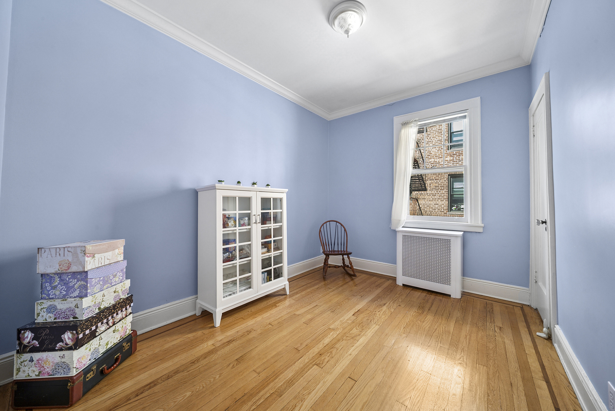 34-15 88th Street Queens, NY 11372 - Photo 11 of 15 an empty room with windows