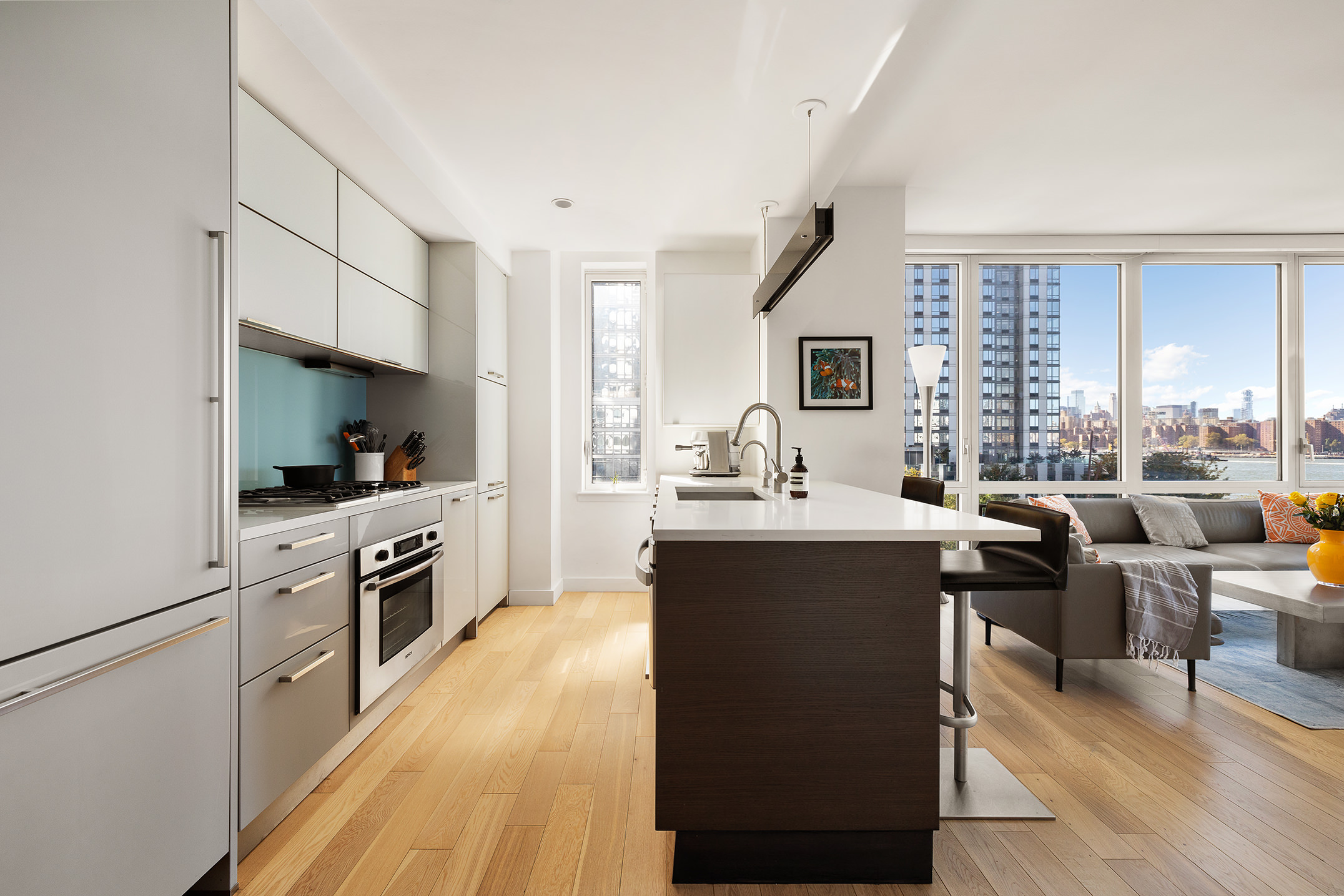 22 North 6th Street, Unit 5C Brooklyn, NY 11249 - Photo 5 of 19 a kitchen with cabinets and chairs