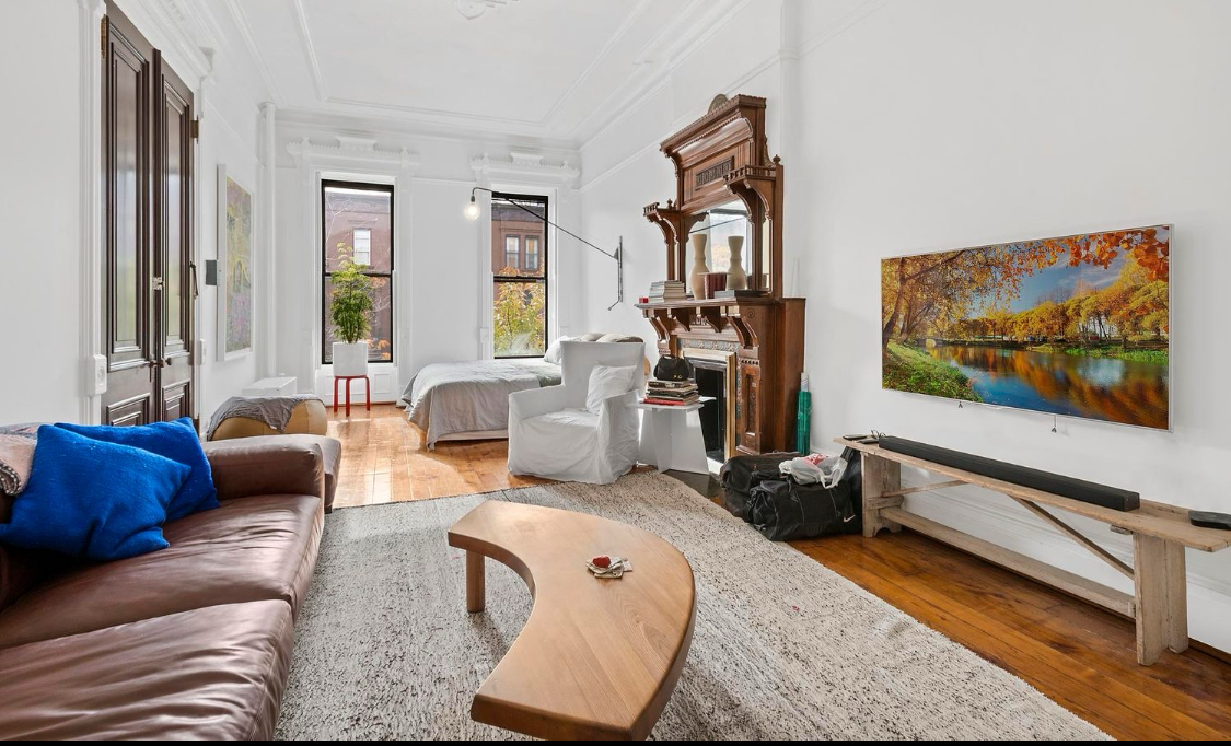 385 Madison Street, Unit 1 Brooklyn, NY 11221 - Photo 3 of 21 a living room with furniture and a flat screen tv