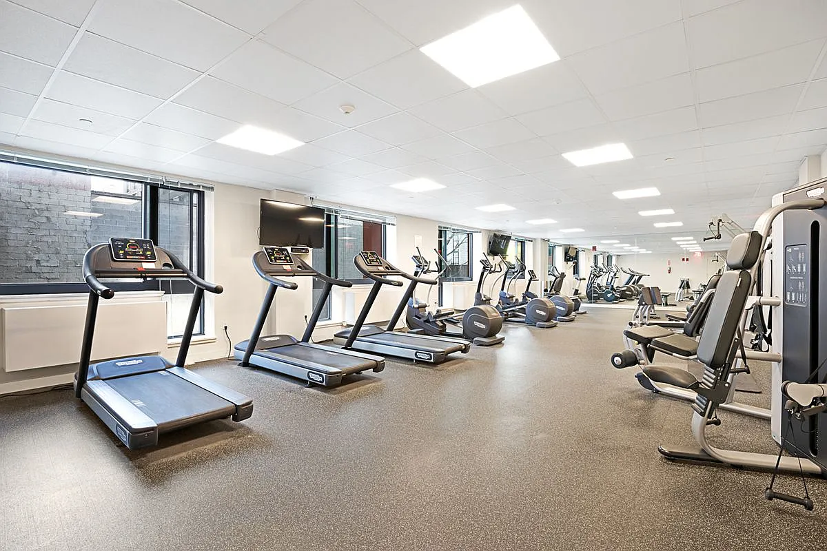 26-14 Jackson Avenue, Unit PHD Queens, NY 11101 - Photo 5 of 11 a view of a room with gym equipment