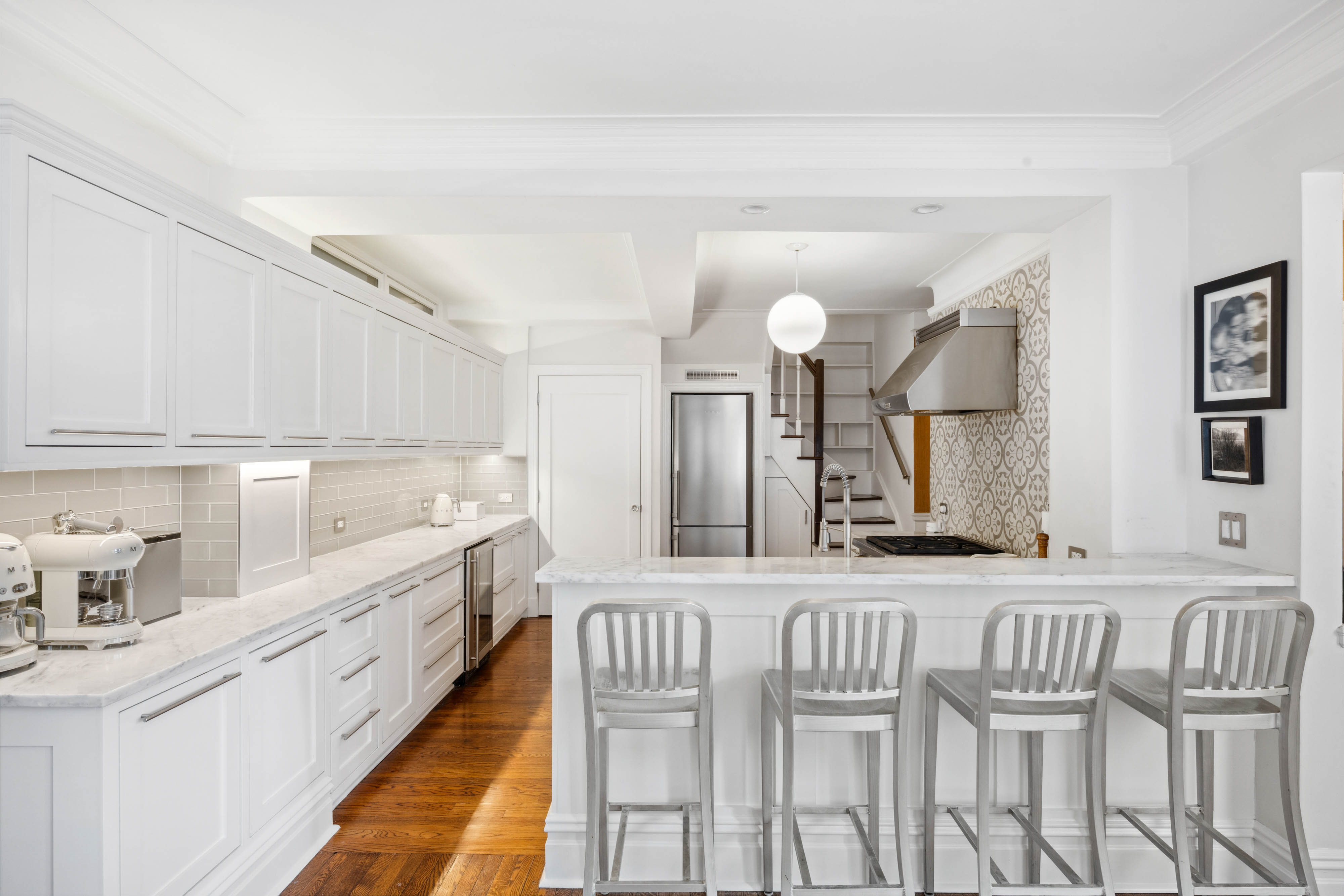 136 East 36th Street, Unit 9/10C Manhattan, NY 10016 - Photo 5 of 27 a kitchen with cabinets and window