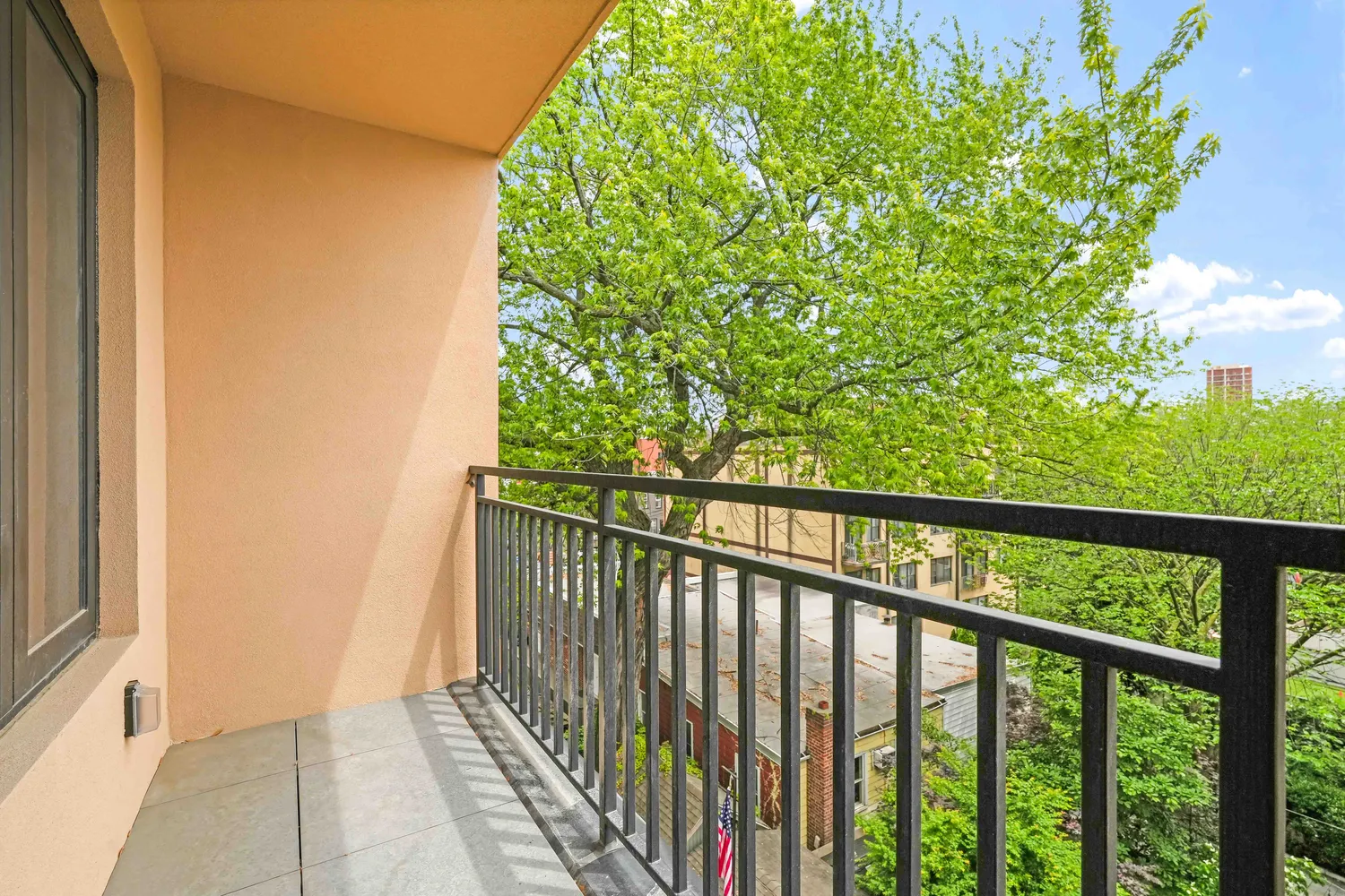a view of balcony with wooden floor
