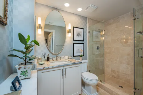 a bathroom with a toilet sink and shower