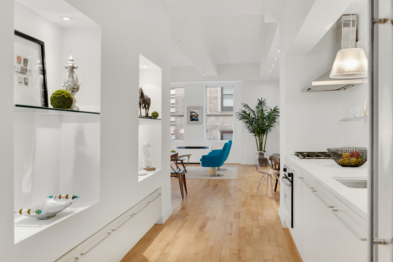 15 Broad Street, Unit 1230 Manhattan, NY 10005 - Photo 4 of 23 a view of a living room and bathroom