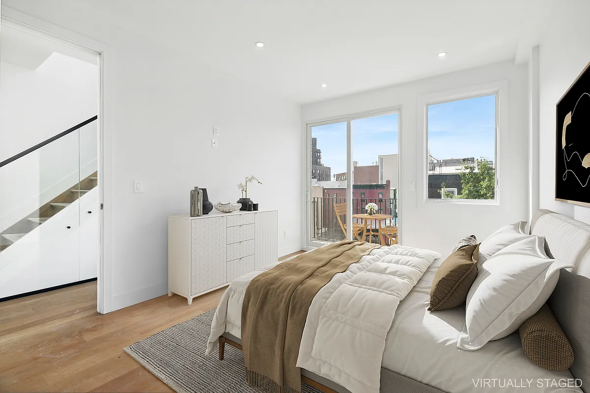 483 Hart Street, Unit PH Brooklyn, NY 11221 - Photo 7 of 17 a bedroom with a bed and a window