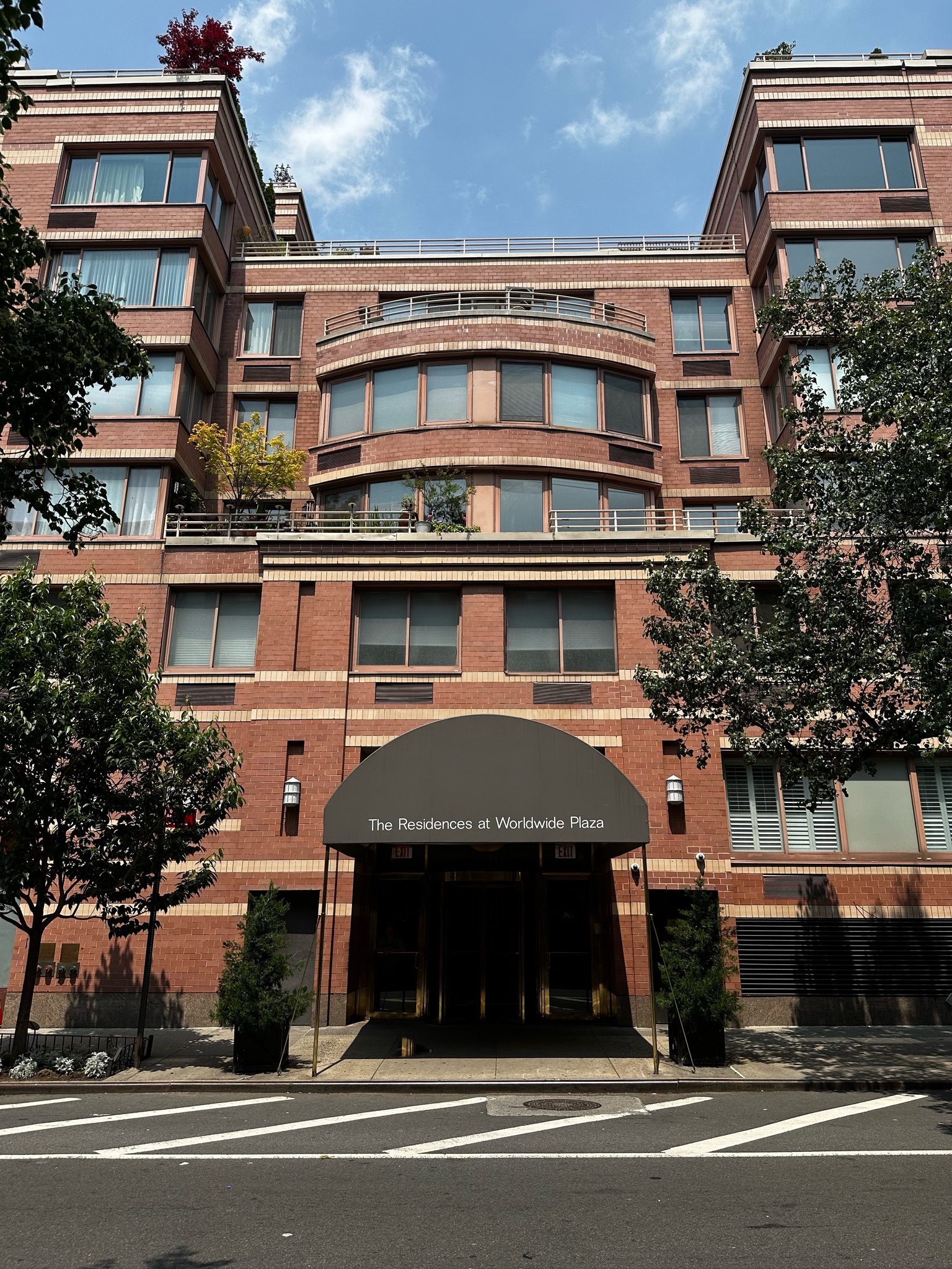 393 West 49th Street, Unit 5C Manhattan, NY 10019 - Photo 15 of 21 a view of a building with a street