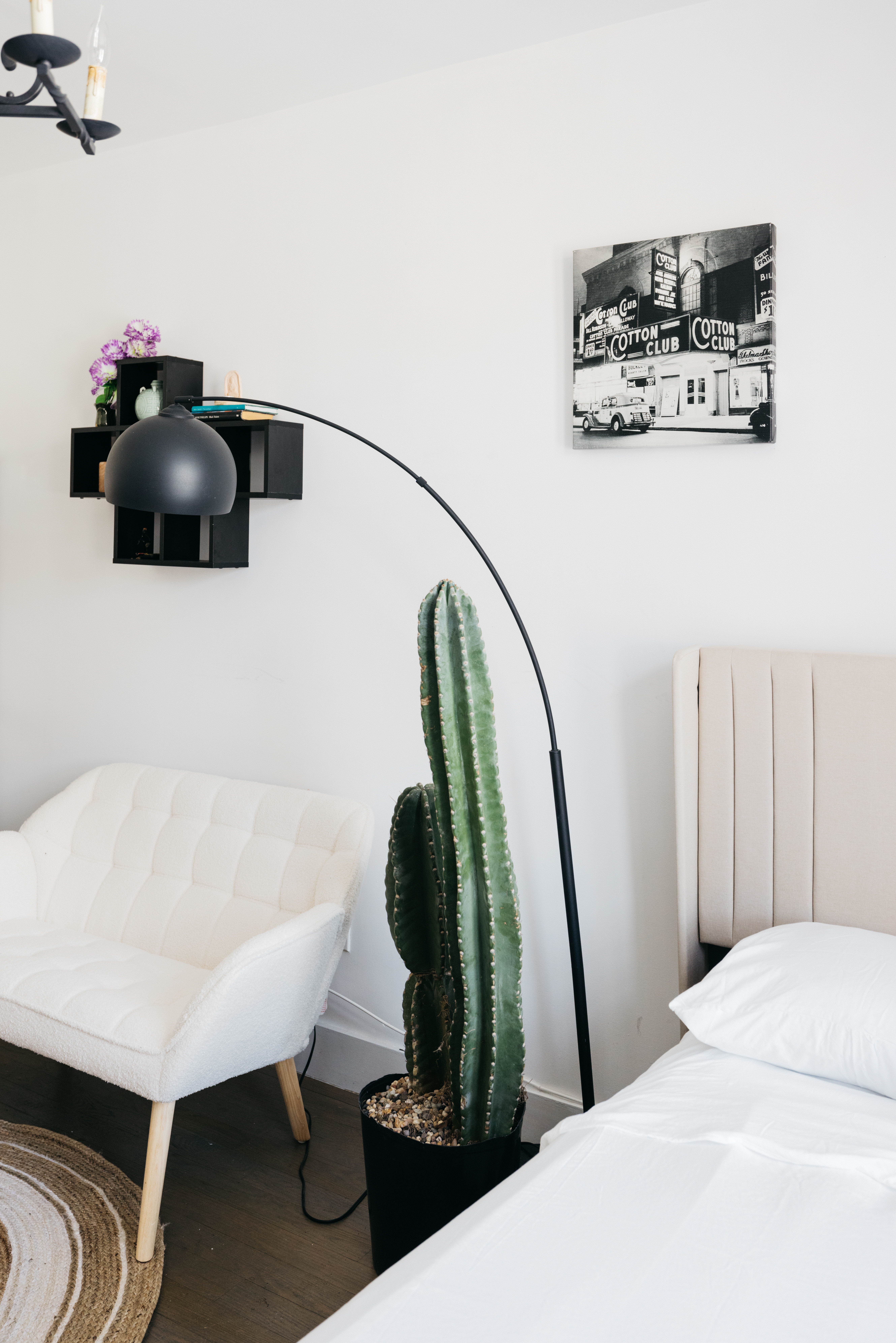 48 West 138th Street, Unit 5J Manhattan, NY 10037 - Photo 5 of 13 a bedroom with a bed and a potted plant