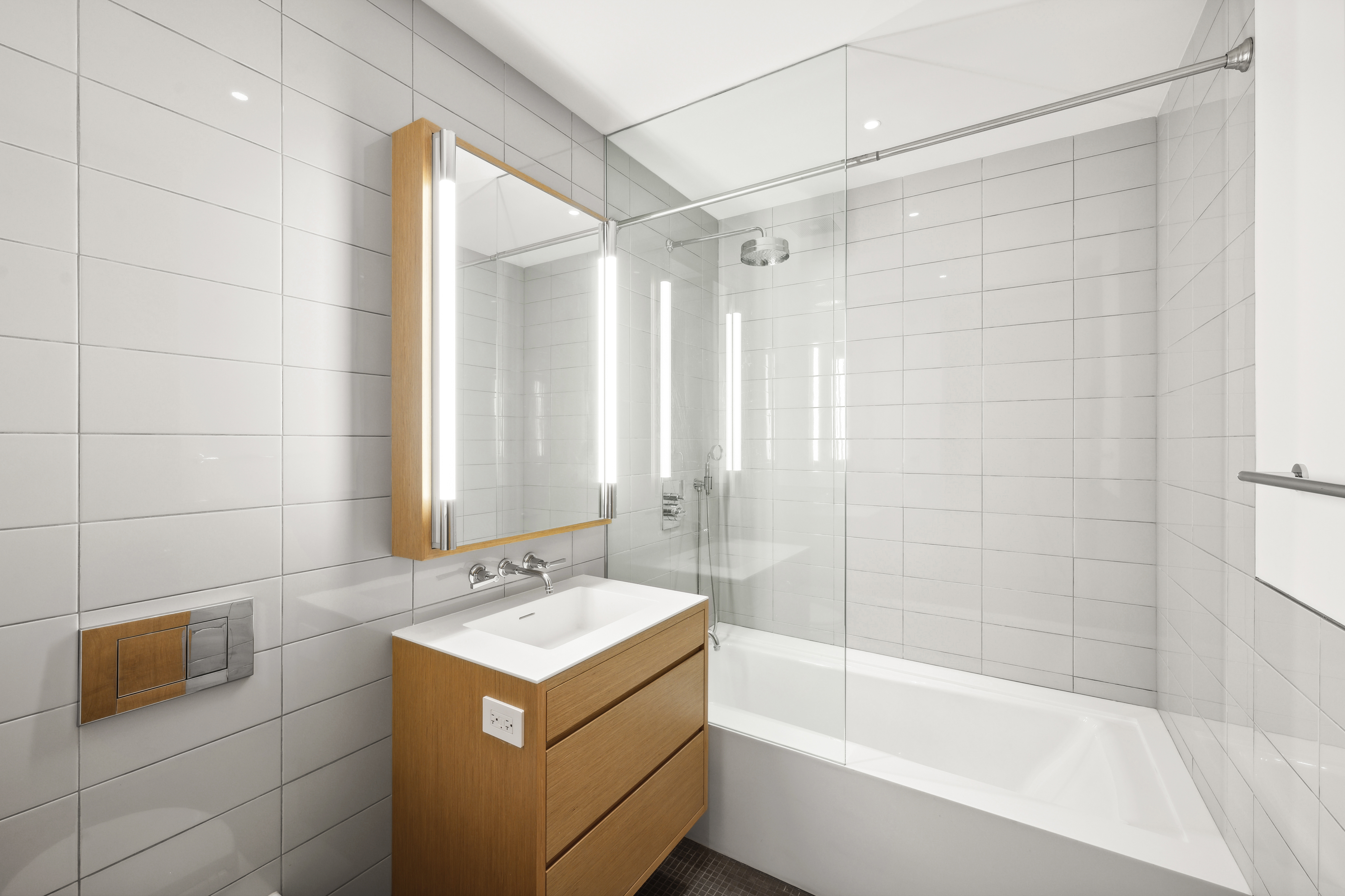 71 Reade Street, Unit 4D Manhattan, NY 10007 - Photo 12 of 15 a bathroom with a sink mirror toilet and bathtub