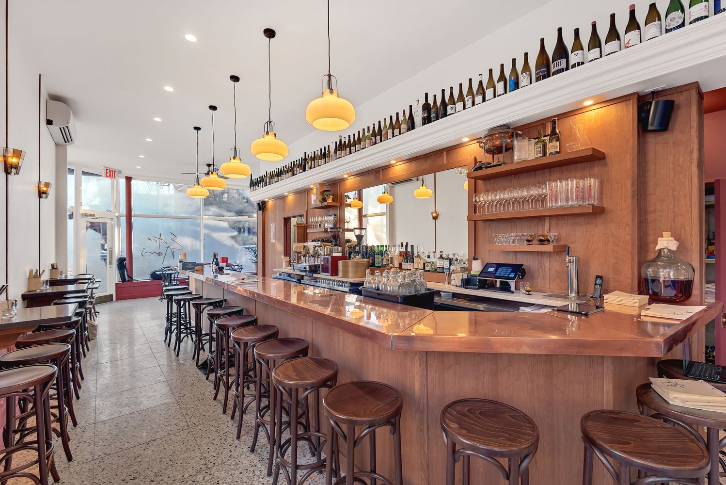 a large kitchen with a table and chairs