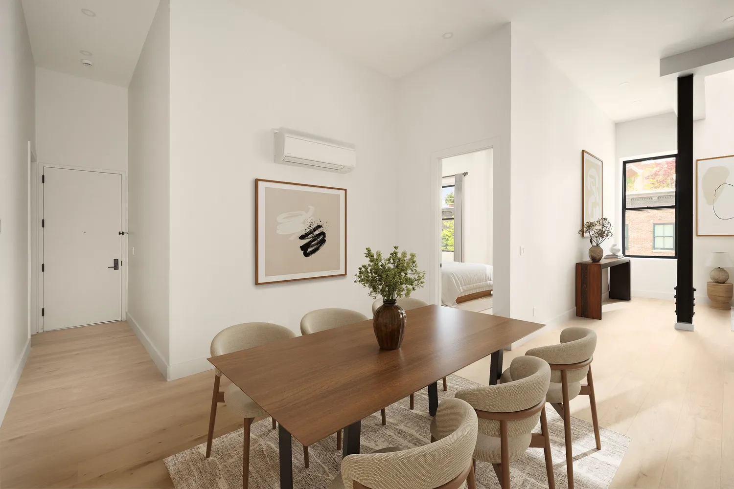 a view of a dining room with furniture and window