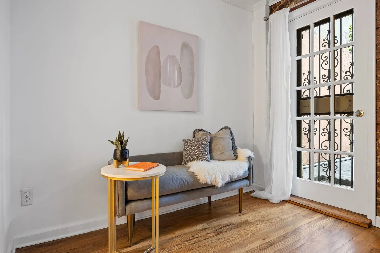 a bedroom with furniture and a window