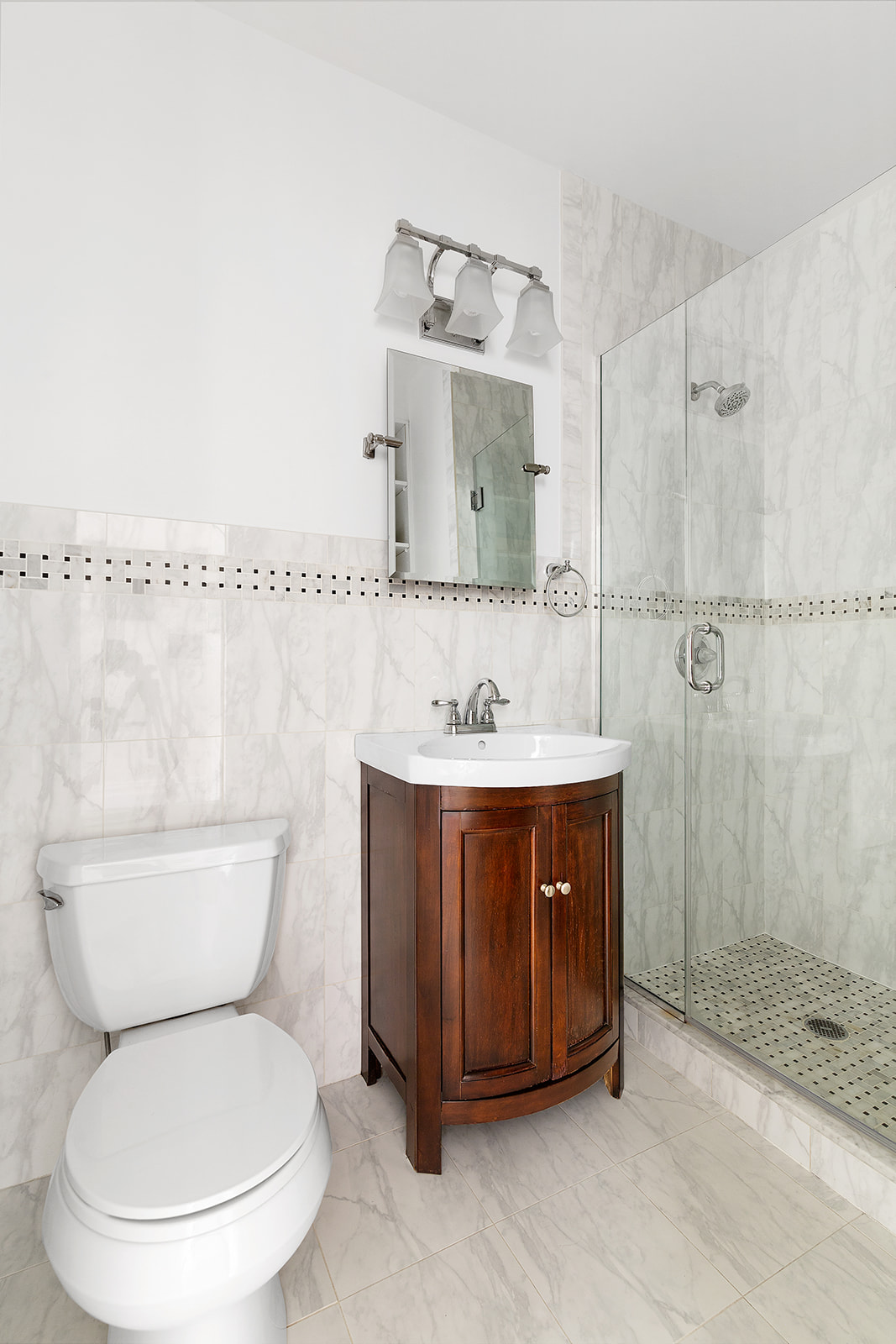 143 Bergen Street, Unit 201 Brooklyn, NY 11217 - Photo 6 of 10 a bathroom with a sink toilet and shower