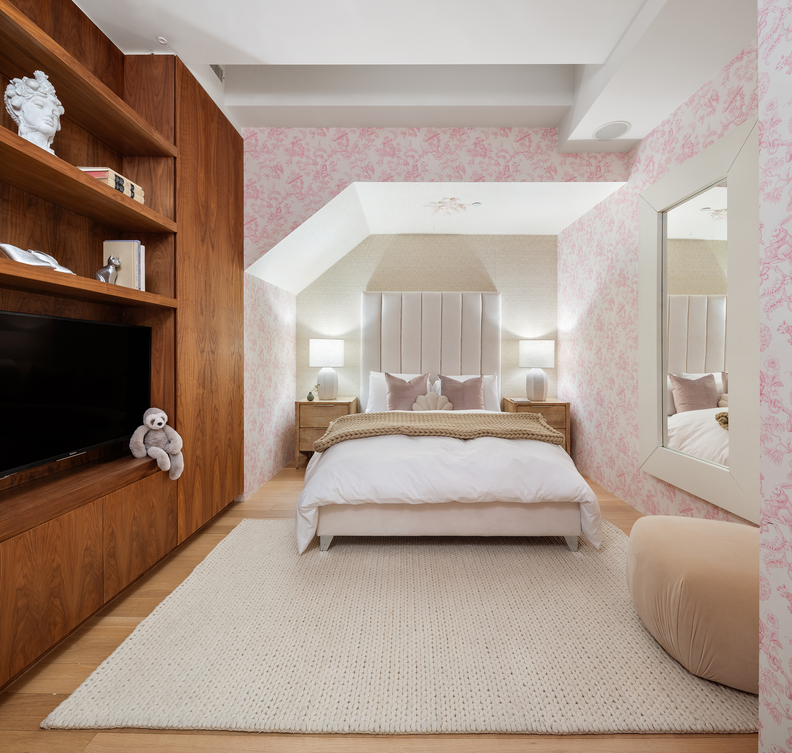 166 Perry Street, Unit 1C Manhattan, NY 10014 - Photo 14 of 18 a bedroom with a bed and a television