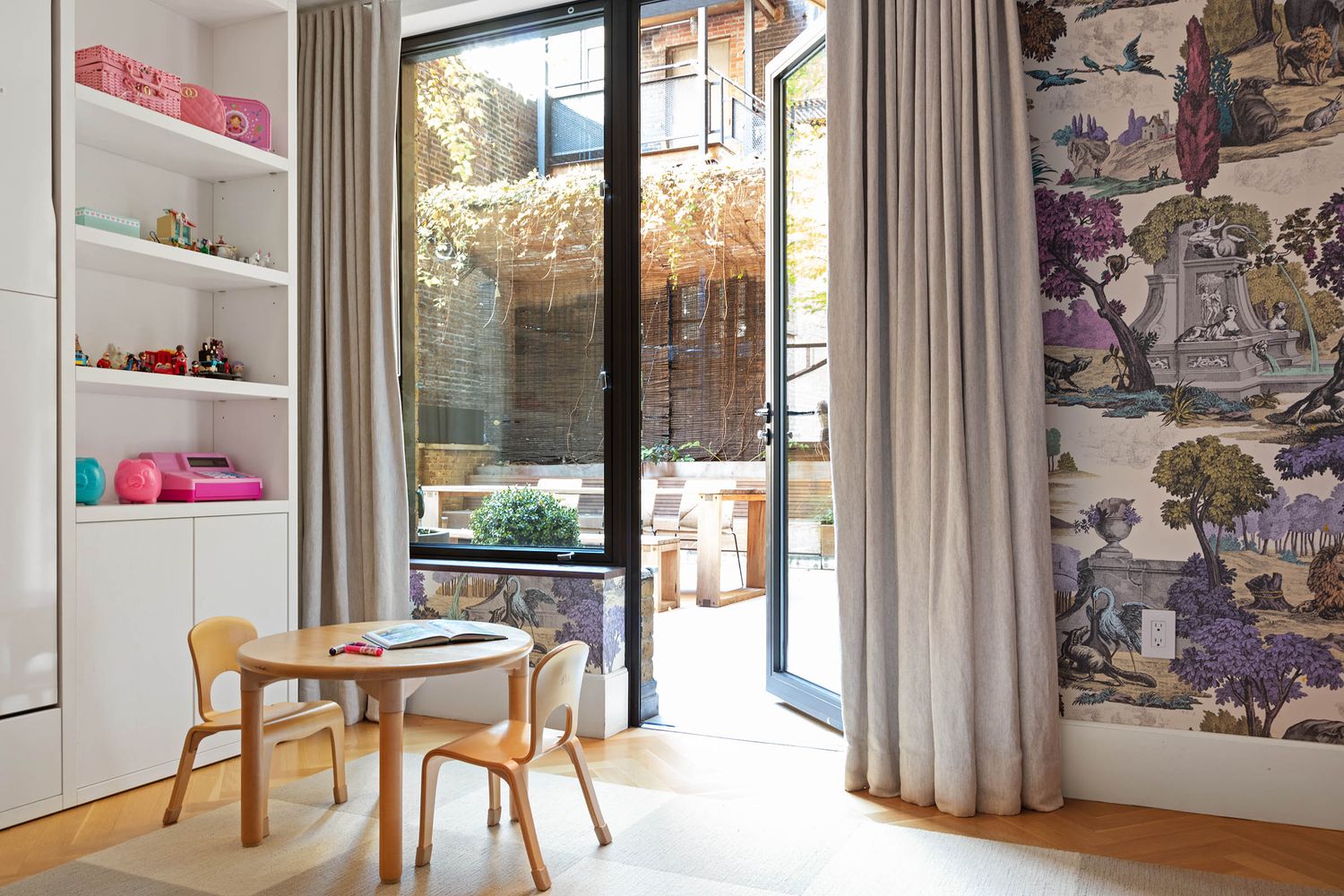 a view of a dining room with furniture and a large window
