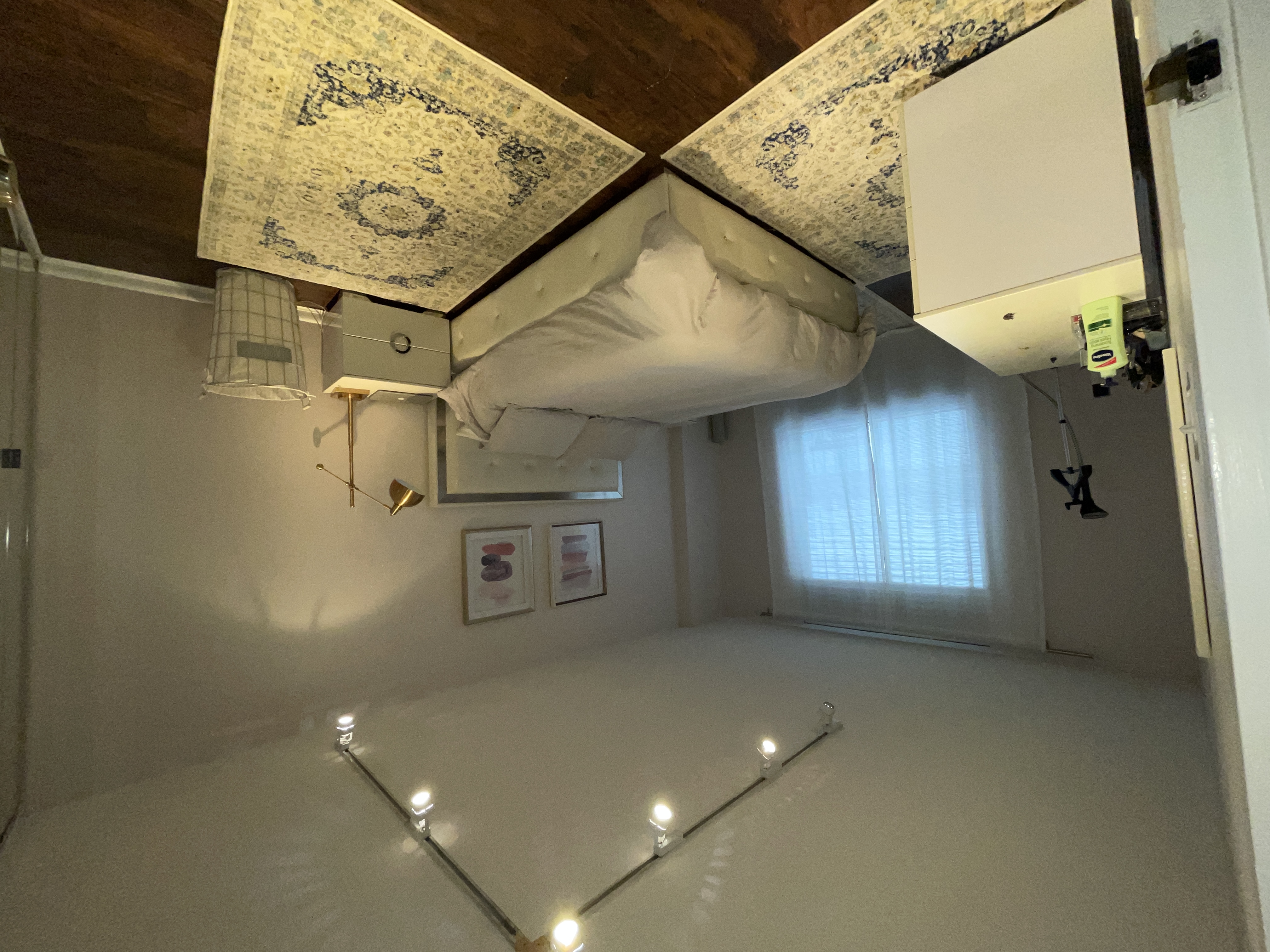 25-40 Shore Boulevard, Unit 8T Queens, NY 11102 - Photo 12 of 23 a bedroom with a bed and a refrigerator