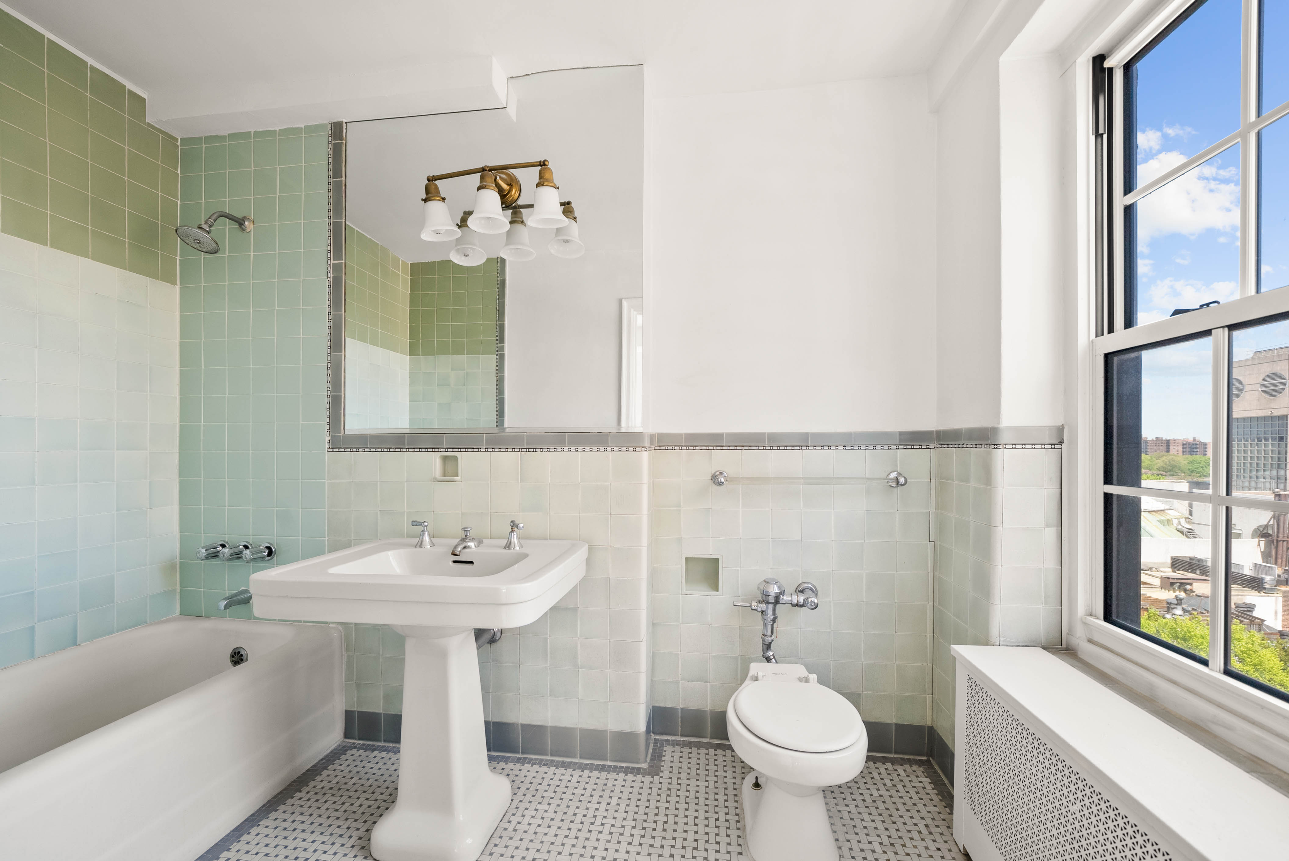 12 East 88th Street, Unit PH11/12B Manhattan, NY 10128 - Photo 11 of 22 a bathroom with a sink toilet and shower