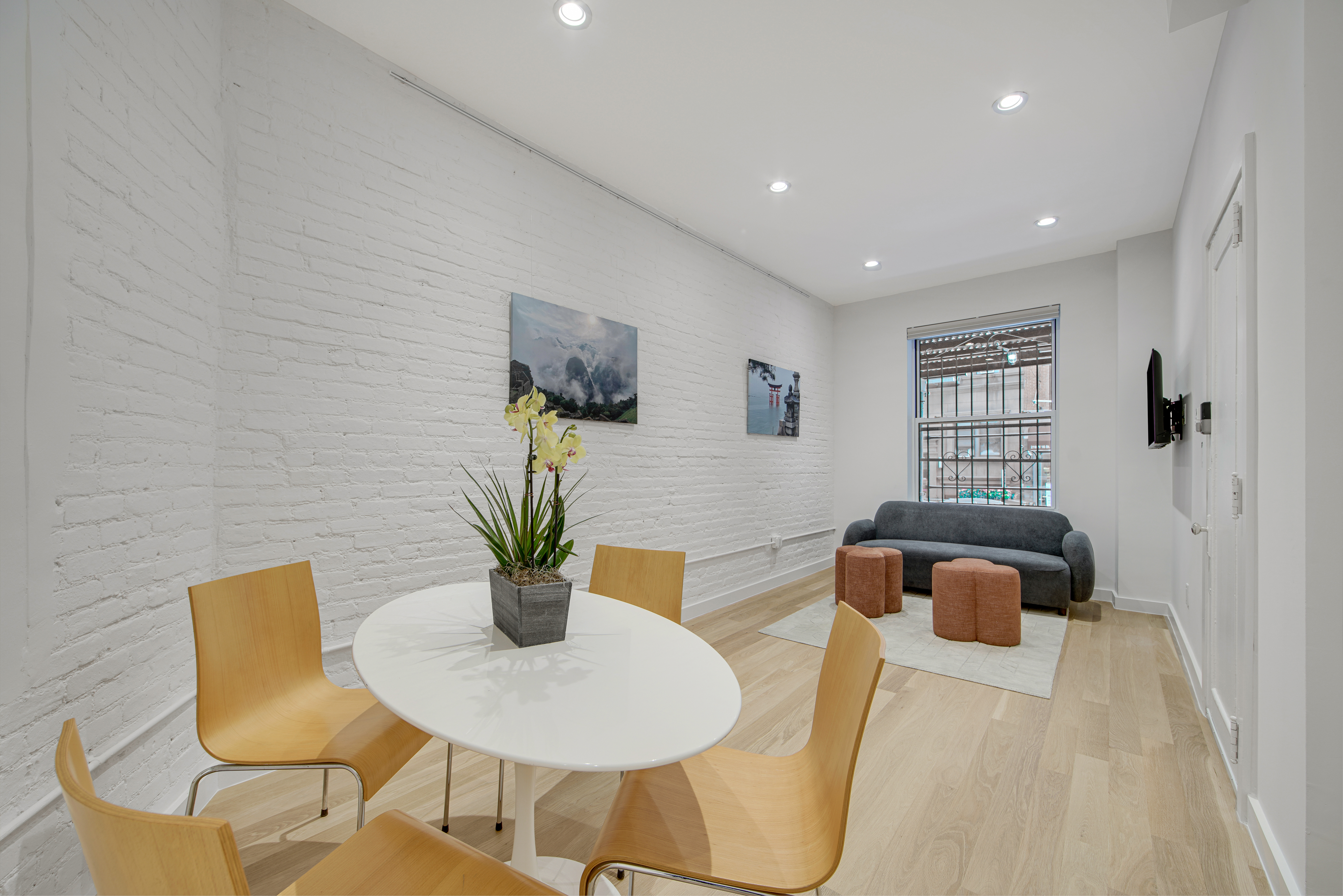 214 West 16th Street, Unit 1W Manhattan, NY 10011 - Photo 2 of 13 a dining room with furniture and wooden floor